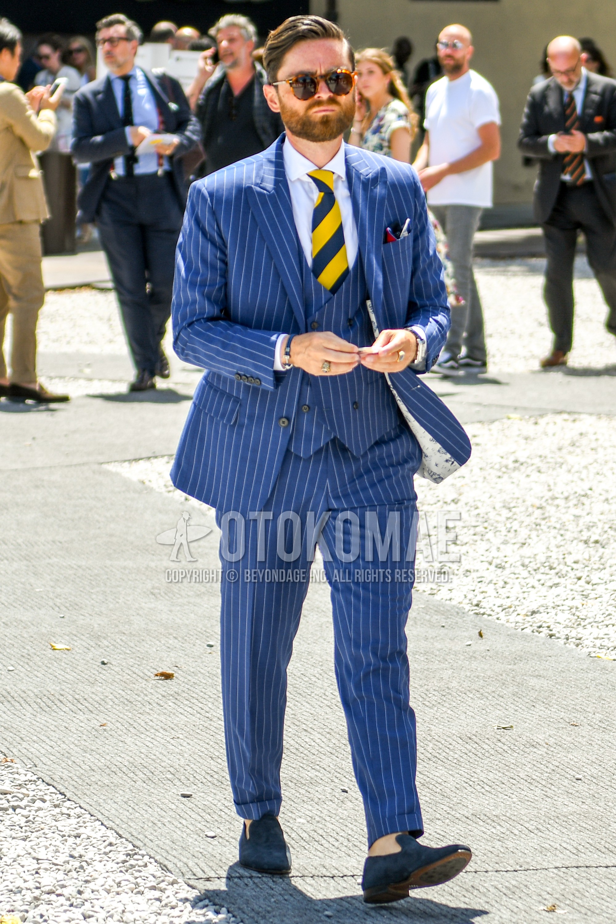 Men's spring summer autumn outfit with tortoiseshell sunglasses, white plain shirt, blue  loafers leather shoes, blue white stripes three-piece suit, yellow blue regimental necktie.