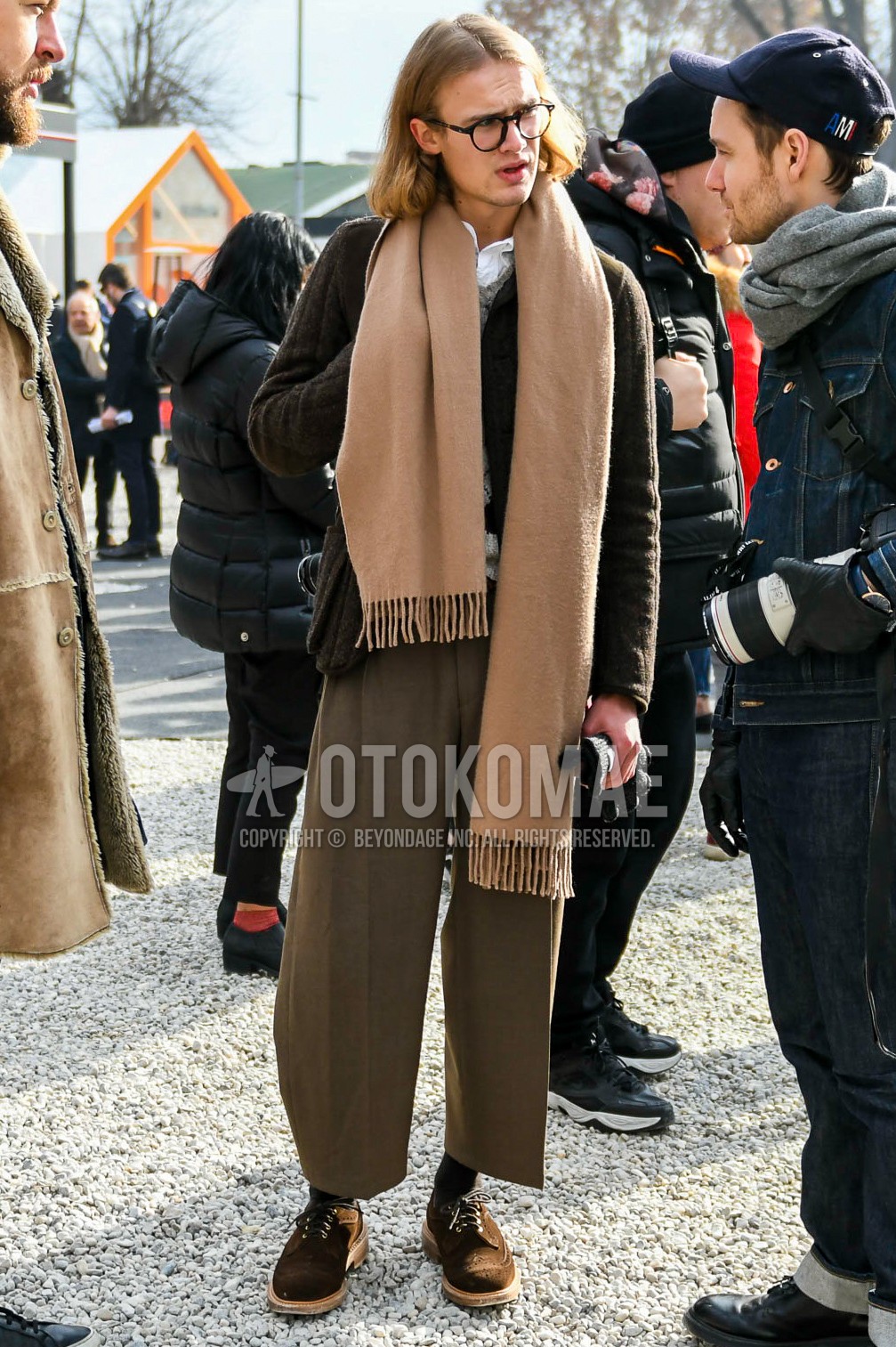 Men's winter outfit with plain glasses, brown plain scarf, brown plain wide pants, brown plain socks, brown suede shoes leather shoes.