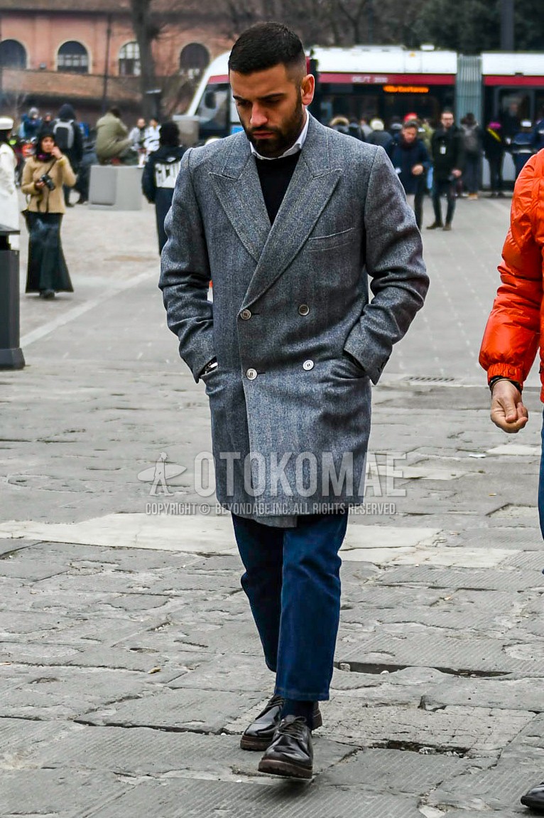 Men's autumn winter outfit with gray stripes chester coat, white plain shirt, black plain sweater, blue plain denim/jeans, navy plain socks, brown plain toe leather shoes.