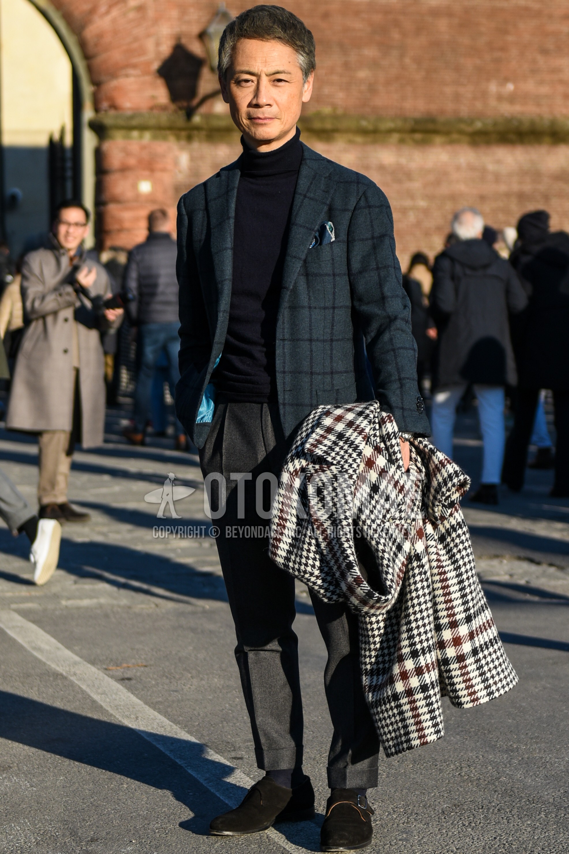 Men's spring autumn outfit with gray check tailored jacket, black plain turtleneck knit, gray plain slacks, gray plain pleated pants, gray plain ankle pants, gray plain socks, brown monk shoes leather shoes.