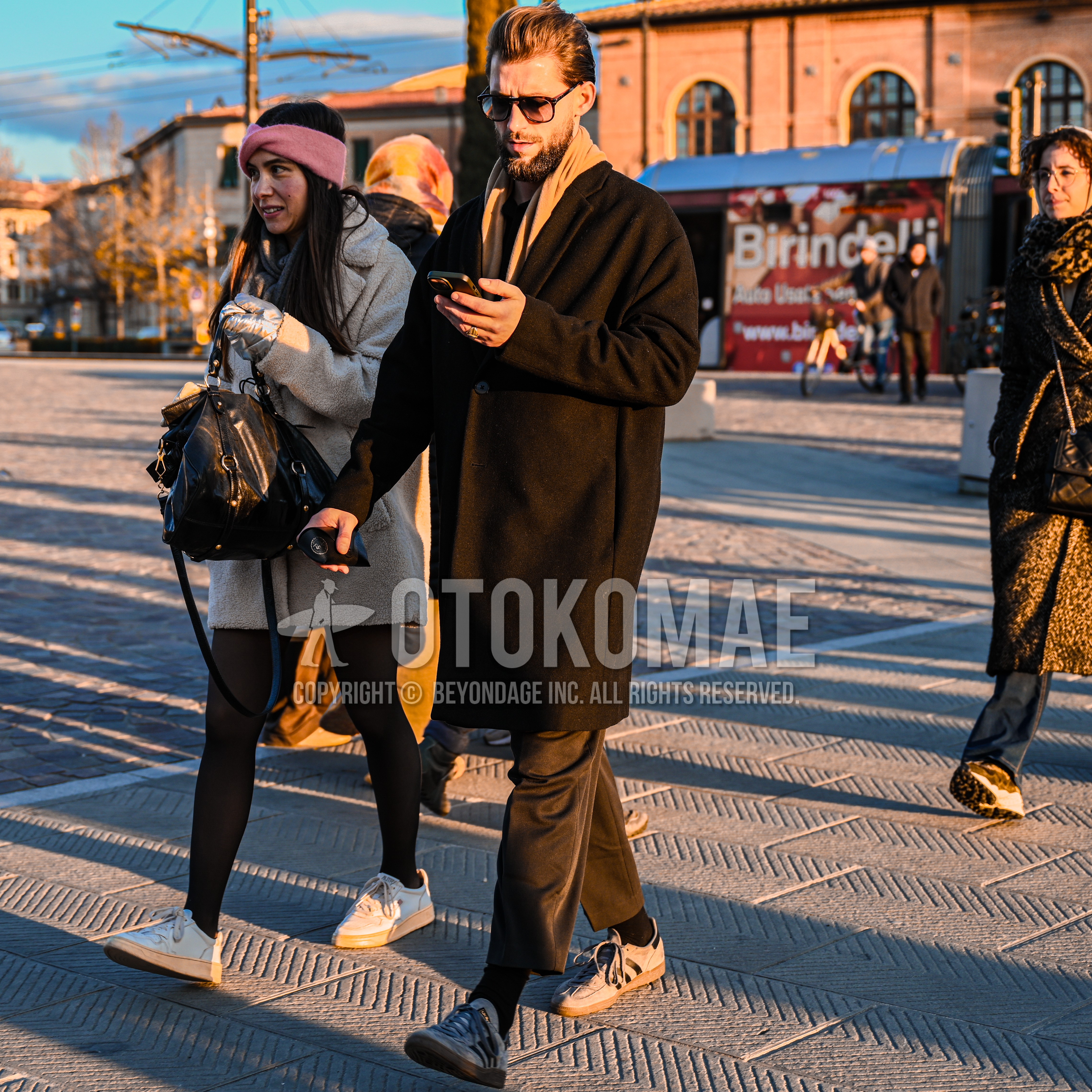 Men's autumn winter outfit with black plain sunglasses, beige plain scarf, brown plain chester coat, dark gray plain winter pants (corduroy,velour), black plain socks, gray low-cut sneakers.
