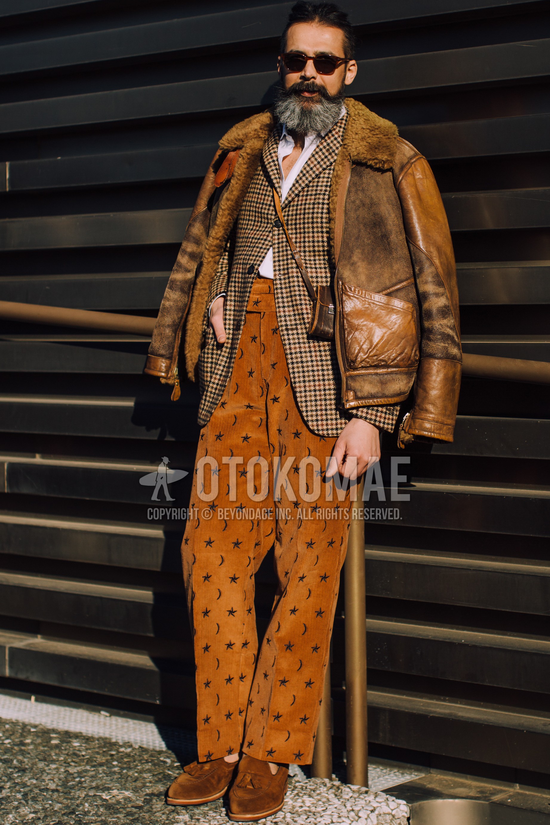 Men's spring winter outfit with black plain sunglasses, brown plain leather jacket, brown check tailored jacket, white plain shirt, orange bottoms winter pants (corduroy,velour), brown tassel loafers leather shoes, brown plain succoshe.