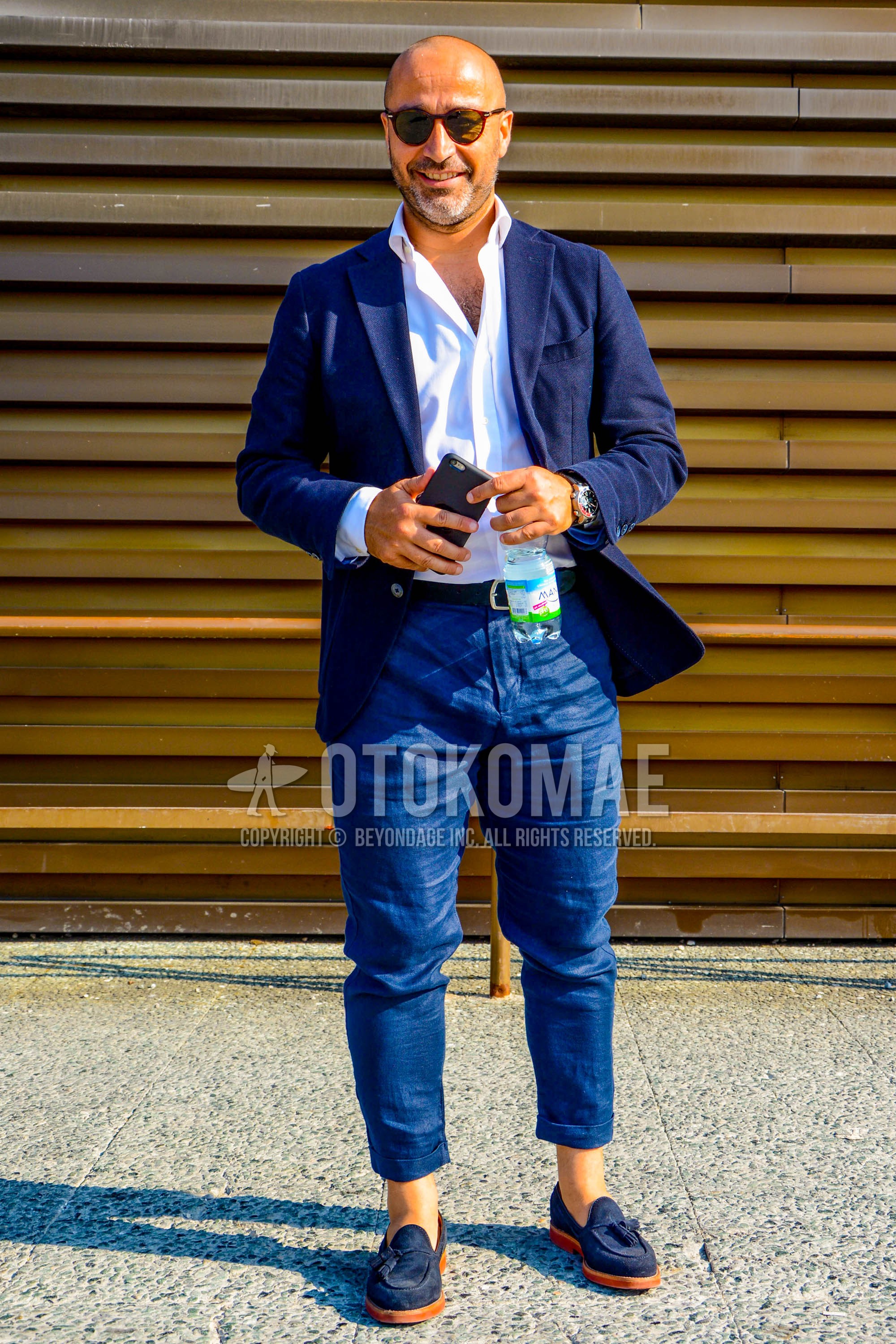 Men's spring summer autumn outfit with plain sunglasses, navy plain tailored jacket, white plain shirt, blue plain cropped pants, navy tassel loafers leather shoes, suede shoes leather shoes.