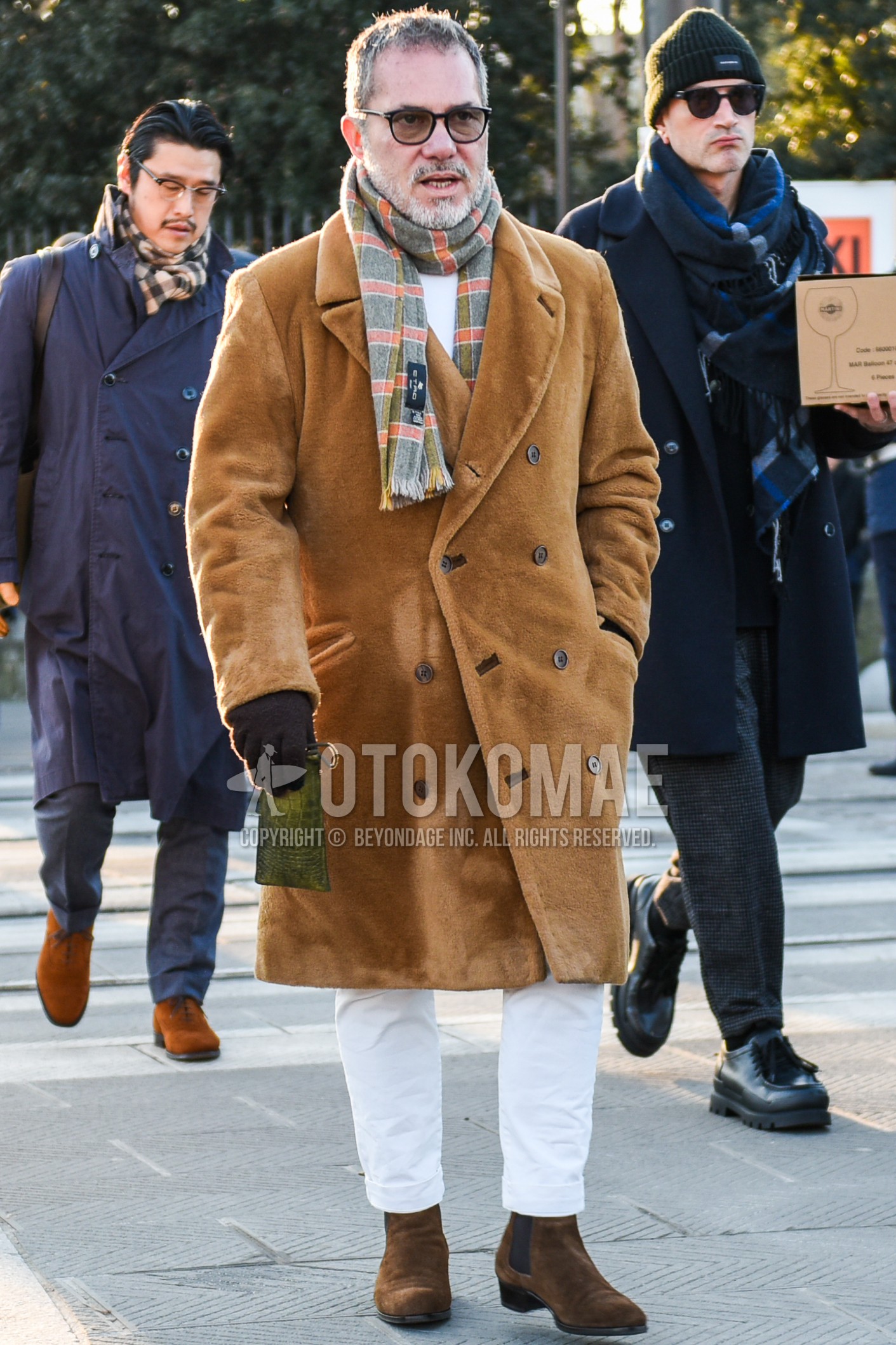 Men's autumn winter outfit with black check sunglasses, gray check scarf, brown plain chester coat, white plain sweater, white plain cotton pants, white plain cropped pants, brown side-gore boots.