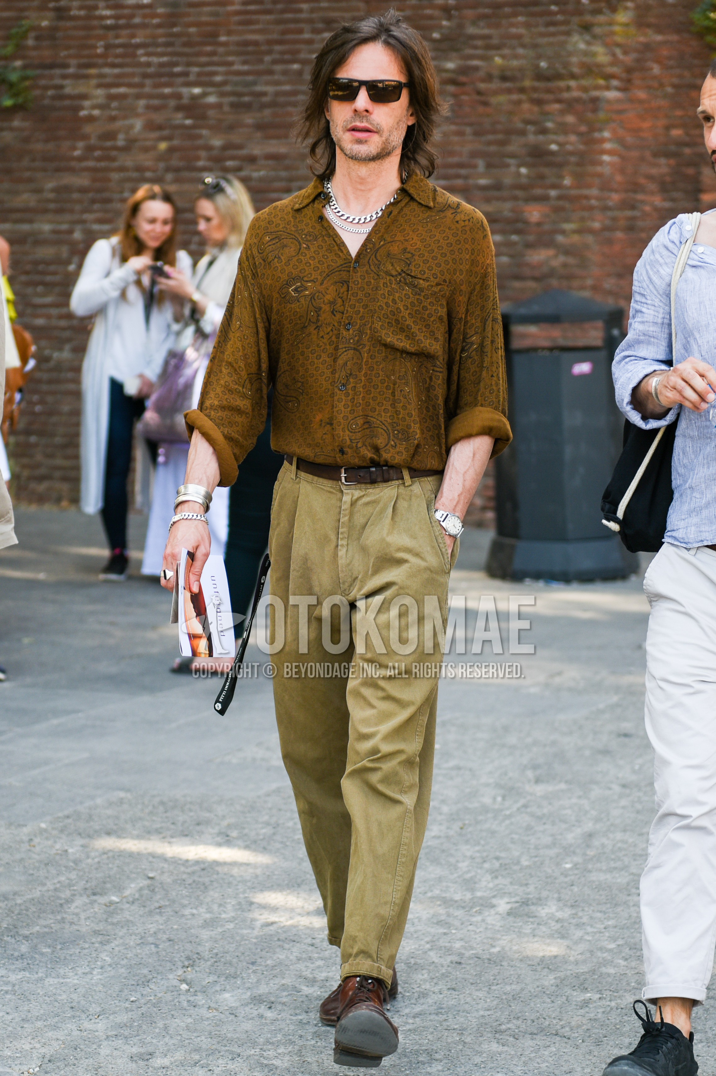Men's spring summer autumn outfit with black plain sunglasses, brown tops/innerwear shirt, brown plain leather belt, beige plain cotton pants, brown  boots.