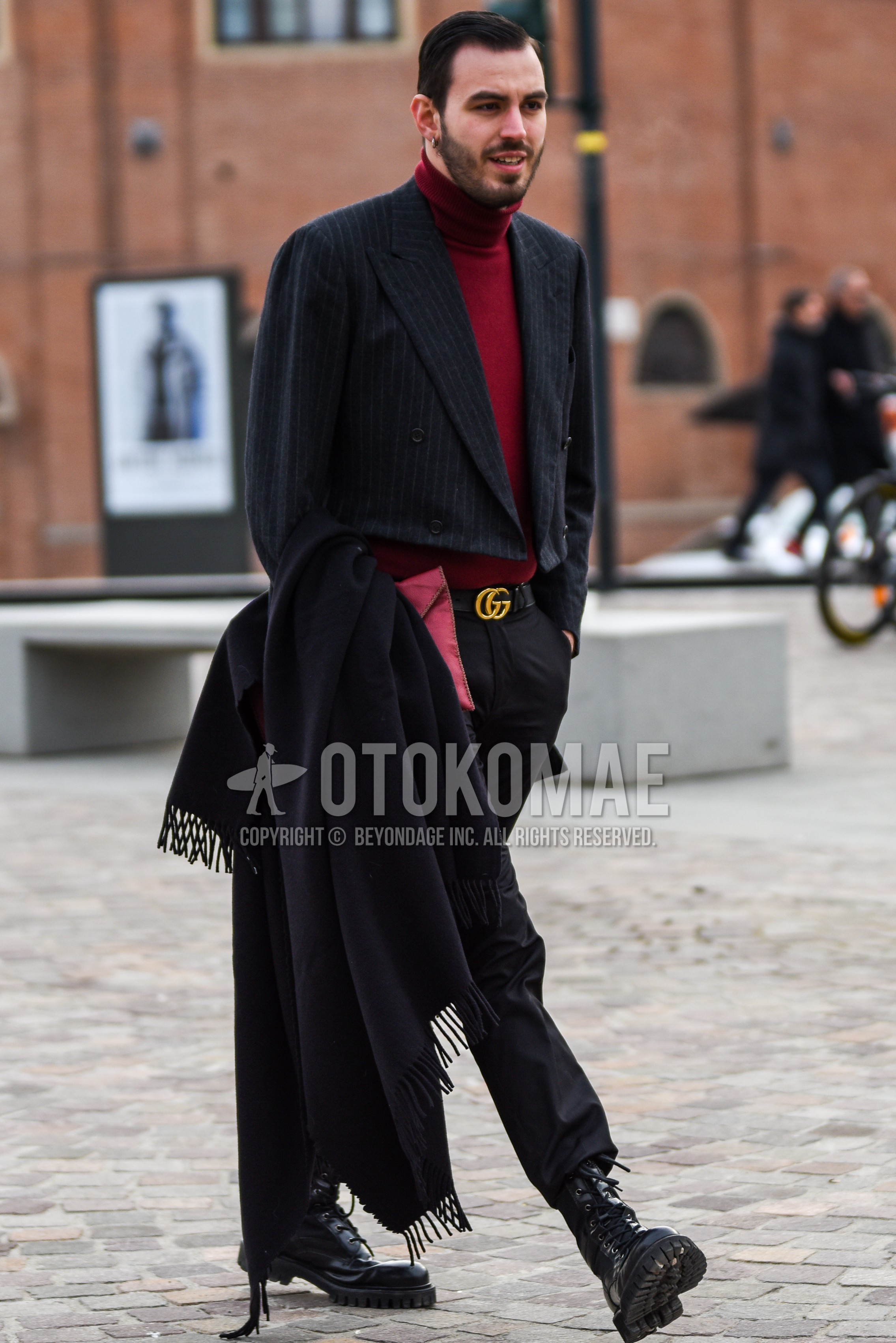 Men's spring autumn outfit with gray stripes tailored jacket, red plain turtleneck knit, black plain leather belt, black plain cotton pants, black  boots.