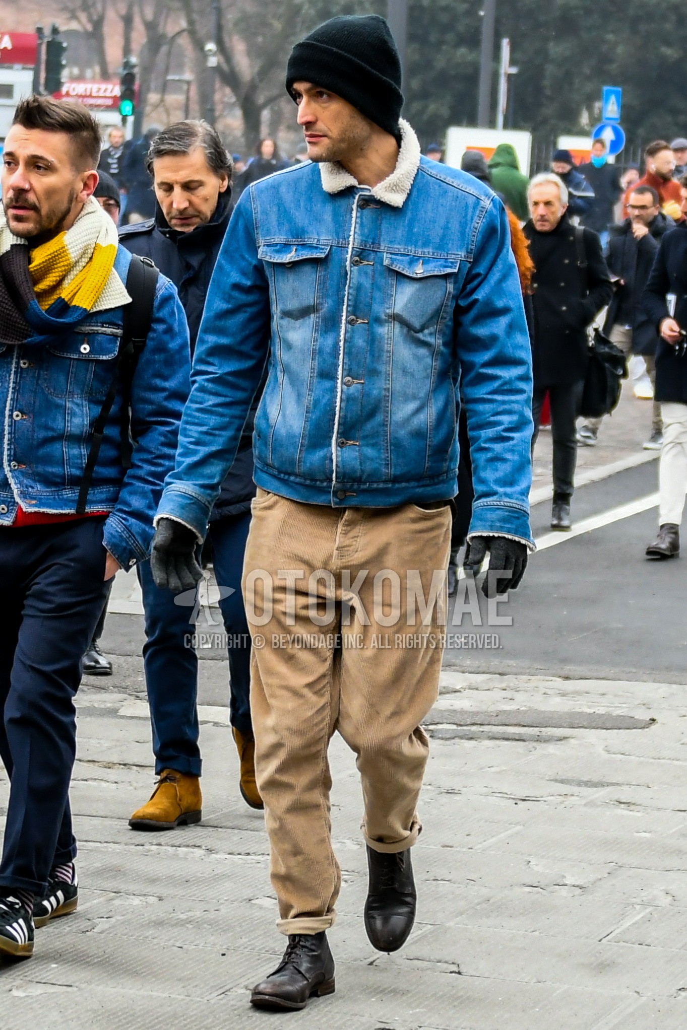 Men's autumn winter outfit with black plain knit cap, blue plain denim jacket, beige plain winter pants (corduroy,velour), brown  boots.