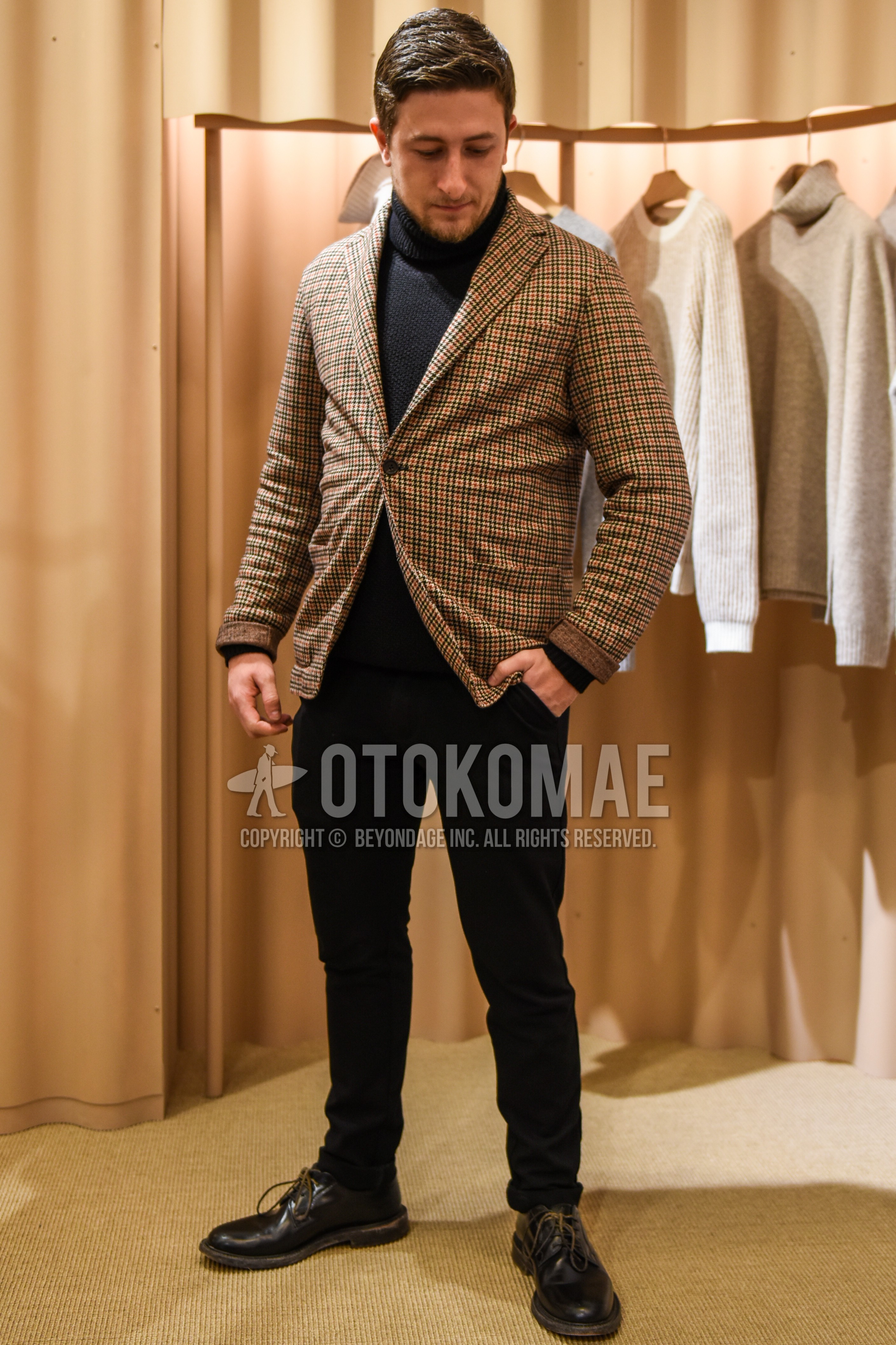 Men's spring autumn outfit with beige check tailored jacket, black plain turtleneck knit, black plain skinny pants, black plain slacks, brown plain toe leather shoes.