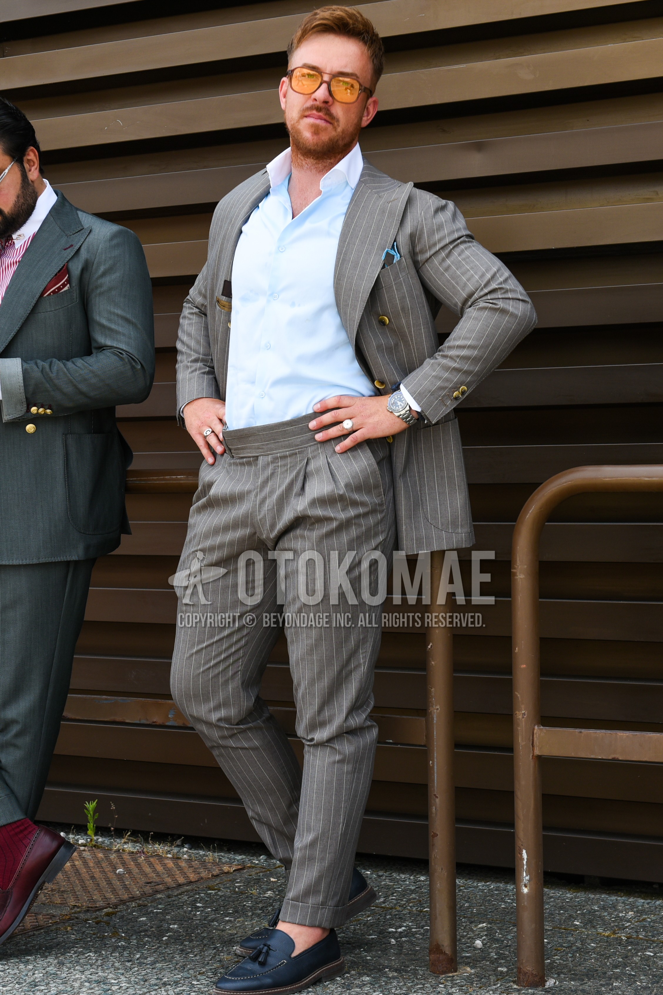 Men's spring summer autumn outfit with yellow plain sunglasses, gray stripes tailored jacket, light blue plain shirt, gray stripes slacks, gray stripes beltless pants, navy tassel loafers leather shoes, gray stripes suit.
