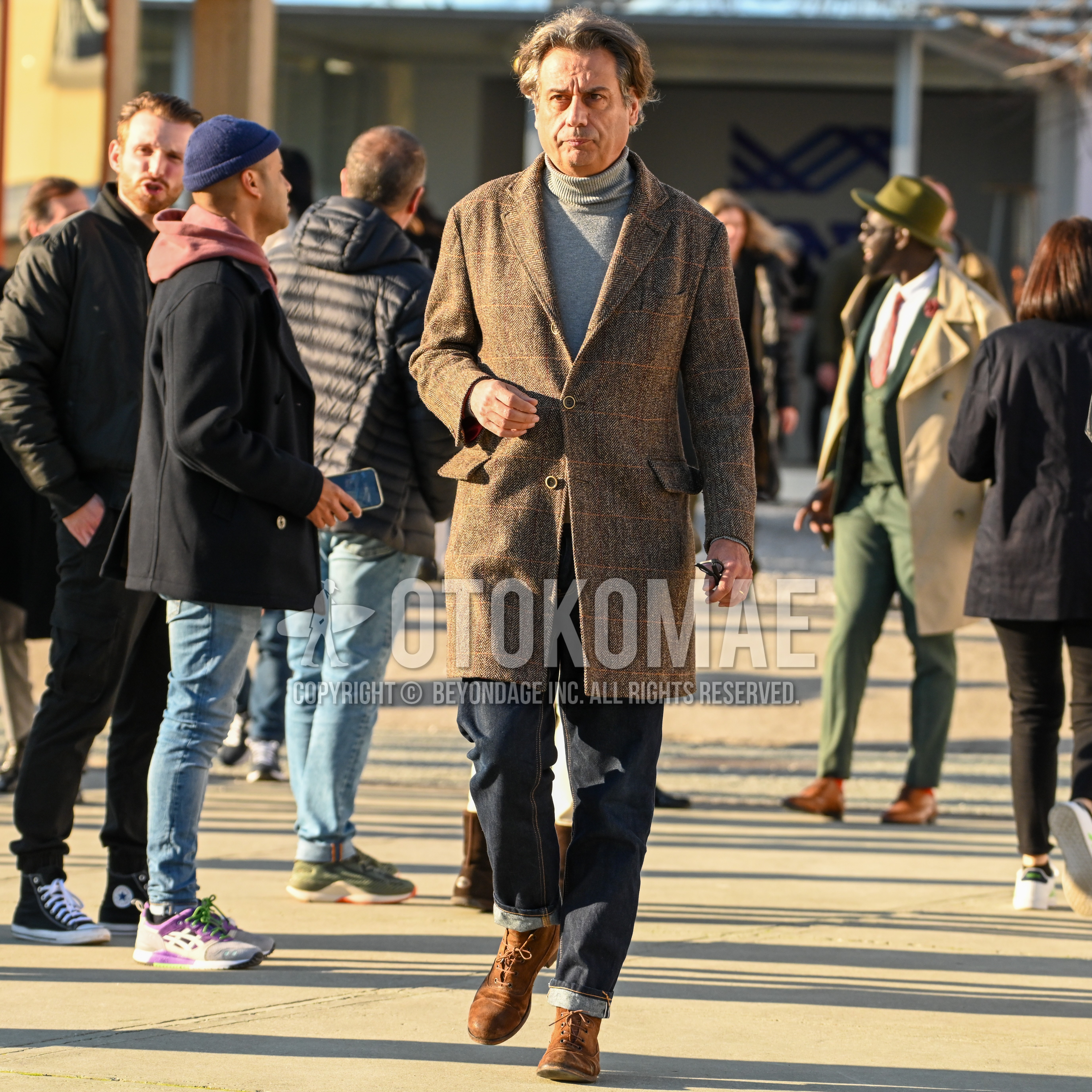 Men's autumn winter outfit with brown check stenkarrer coat, gray plain turtleneck knit, plain denim/jeans, brown  boots.