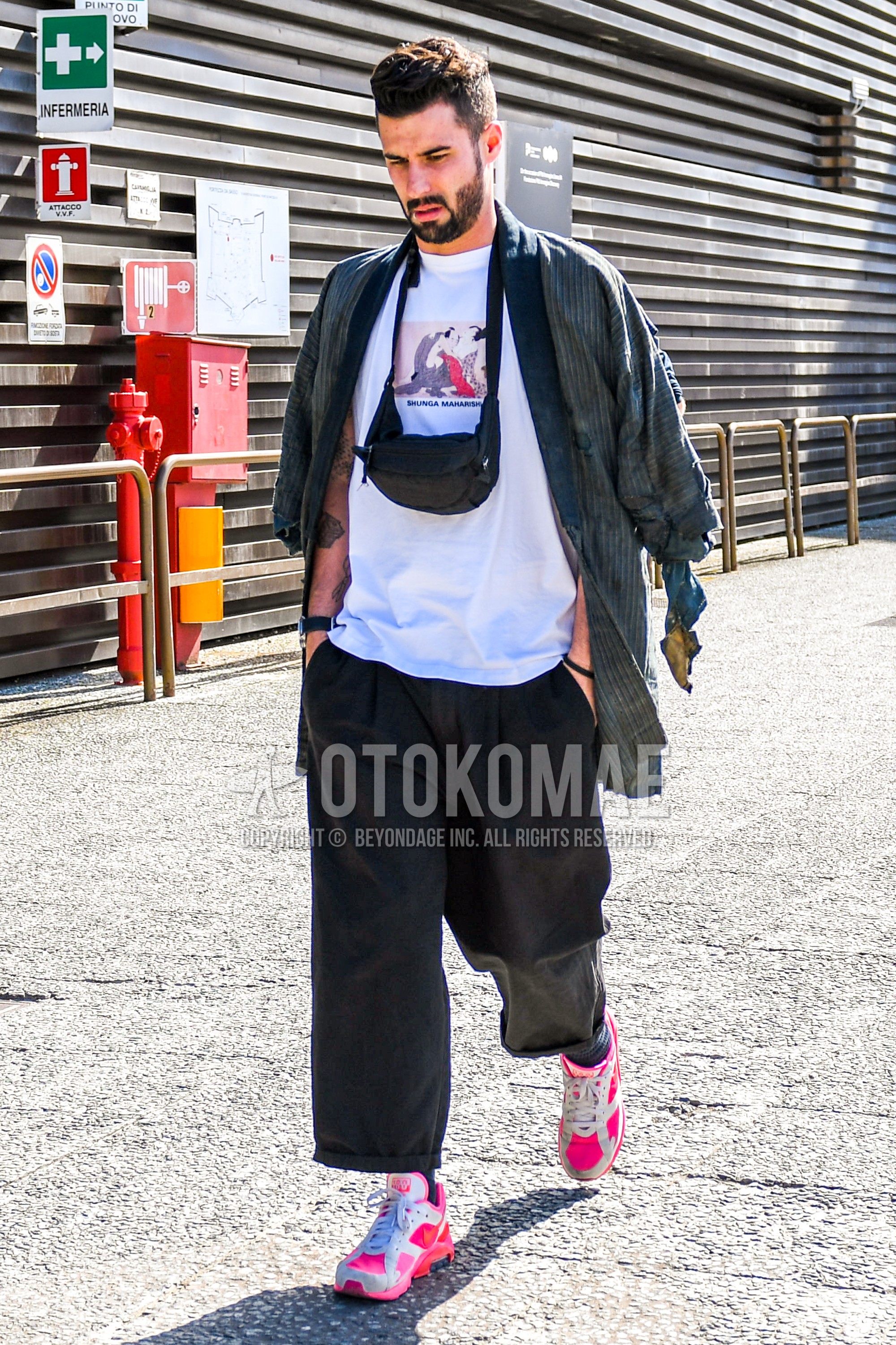Men's spring summer autumn outfit with gray stripes outerwear, white graphic t-shirt, black plain wide pants, socks, white pink low-cut sneakers, black plain body bag.