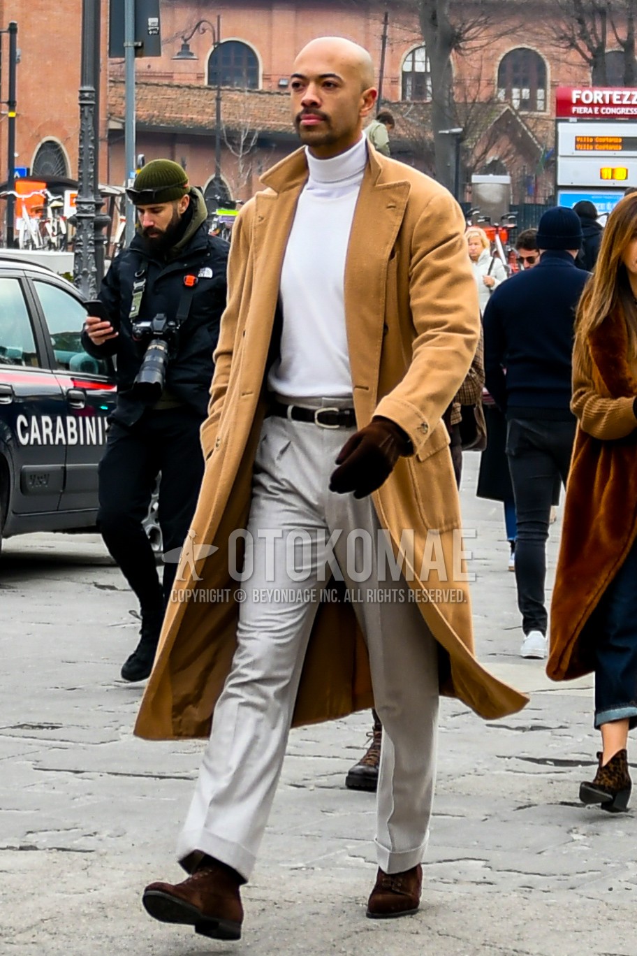 Men's winter outfit with brown plain chester coat, white plain turtleneck knit, black plain leather belt, white plain slacks, brown  boots.