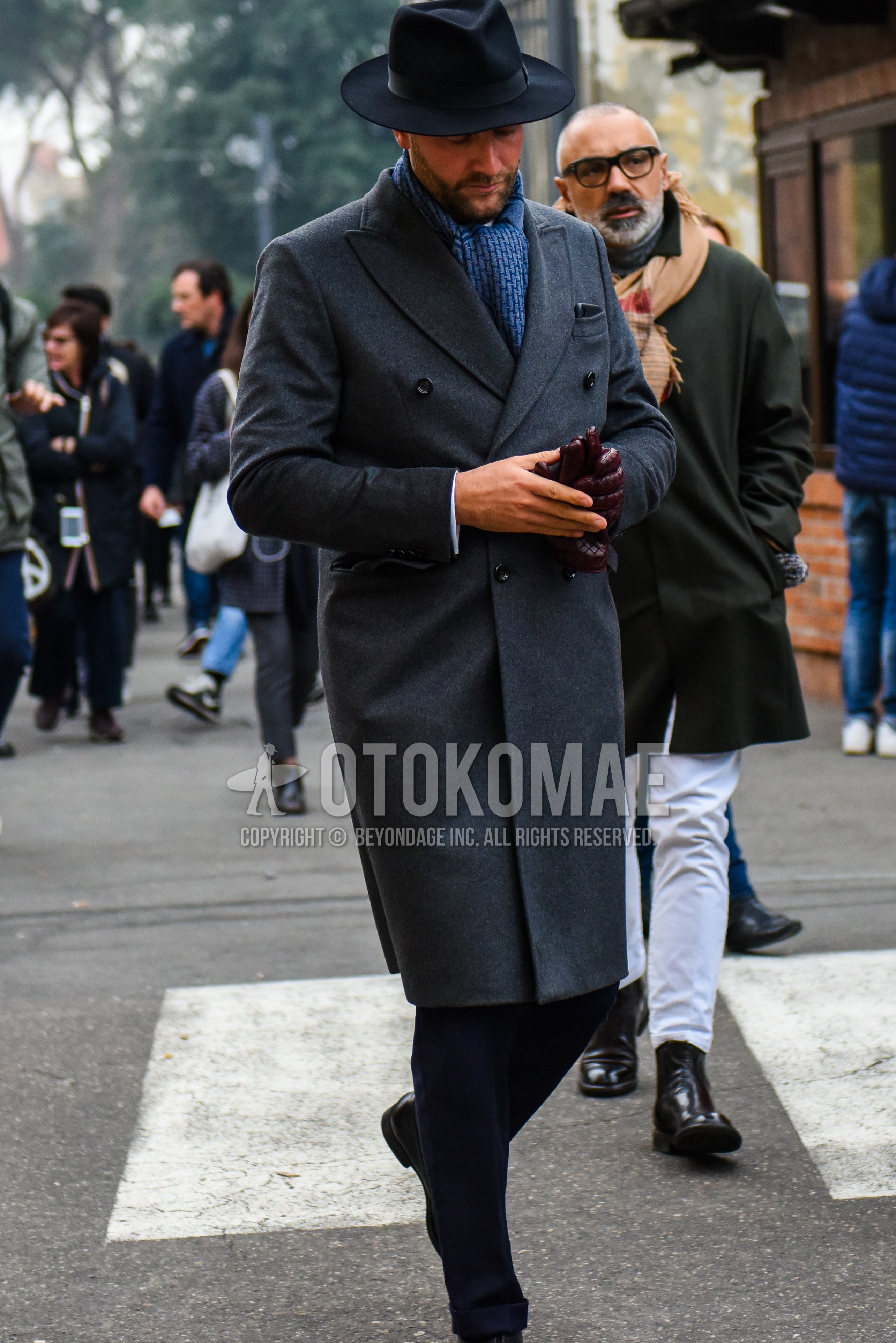 Men's winter outfit with black plain hat, blue scarf scarf, gray plain chester coat, black plain slacks.