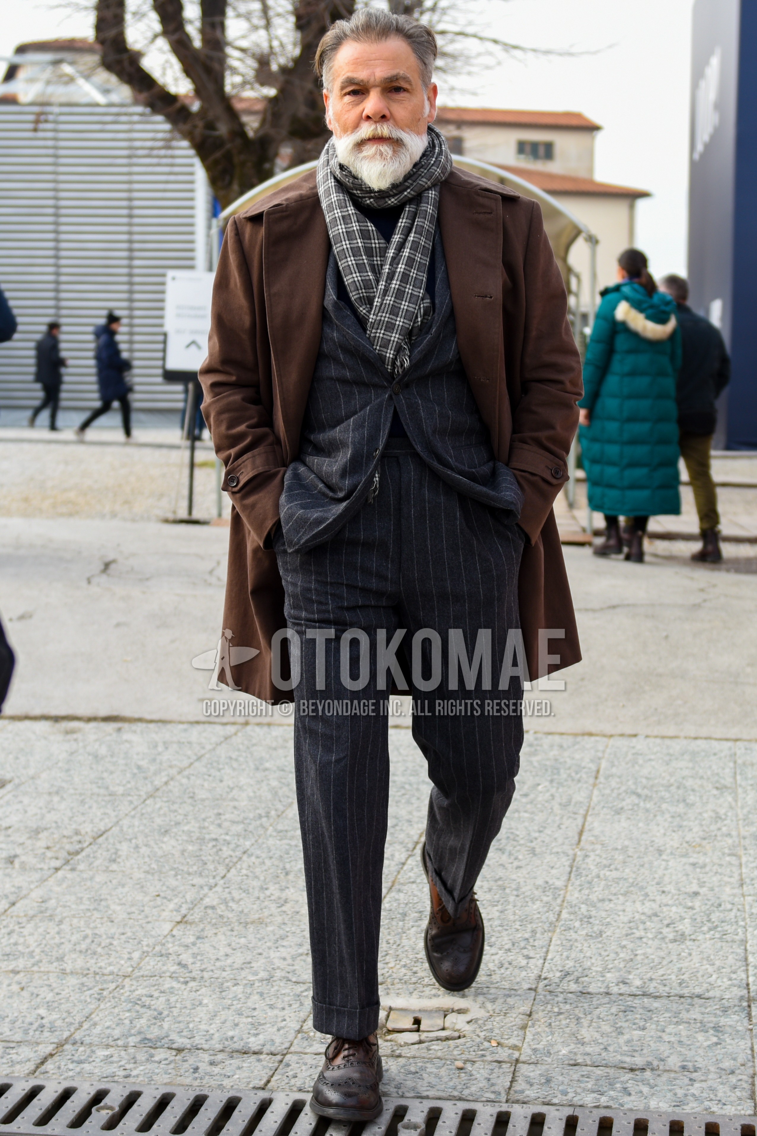 Men's autumn winter outfit with gray check scarf, brown plain trench coat, brown  boots, gray stripes suit.