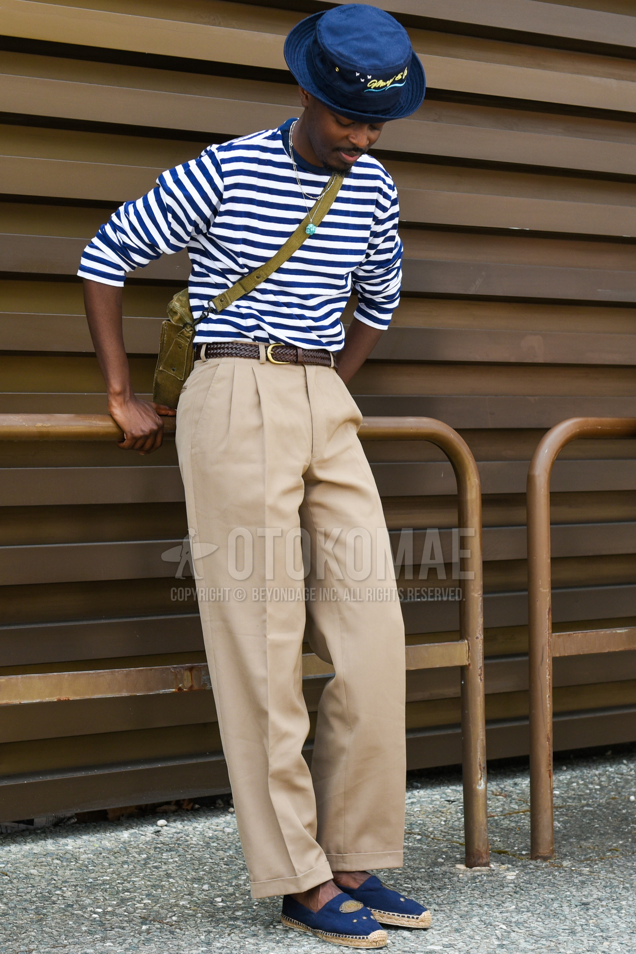 Men's spring summer outfit with navy plain bucket hat, navy horizontal  stripes long sleeve t-shirt