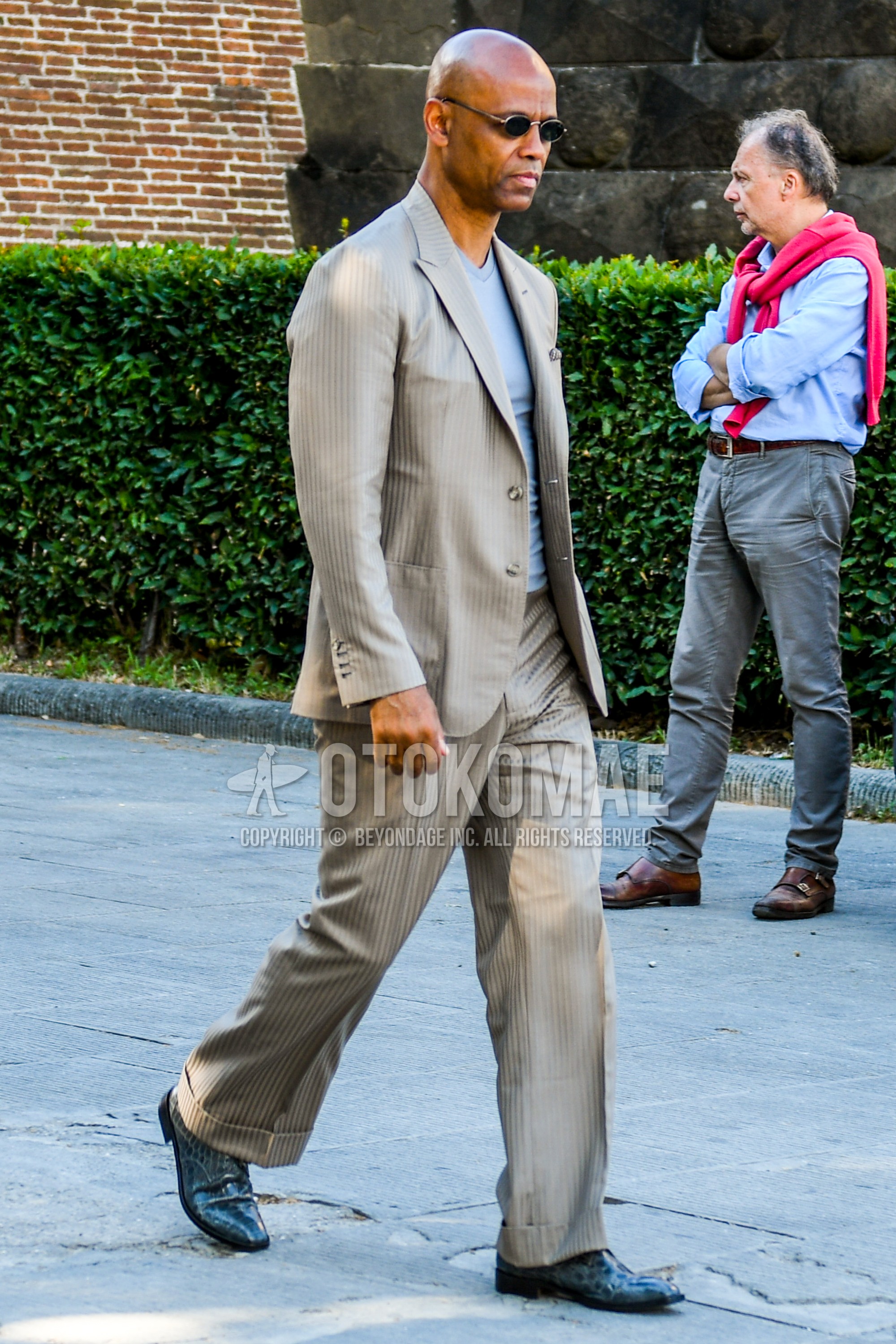 Men's spring summer autumn outfit with silver plain sunglasses, gray plain t-shirt, blue  leather shoes, beige stripes suit.
