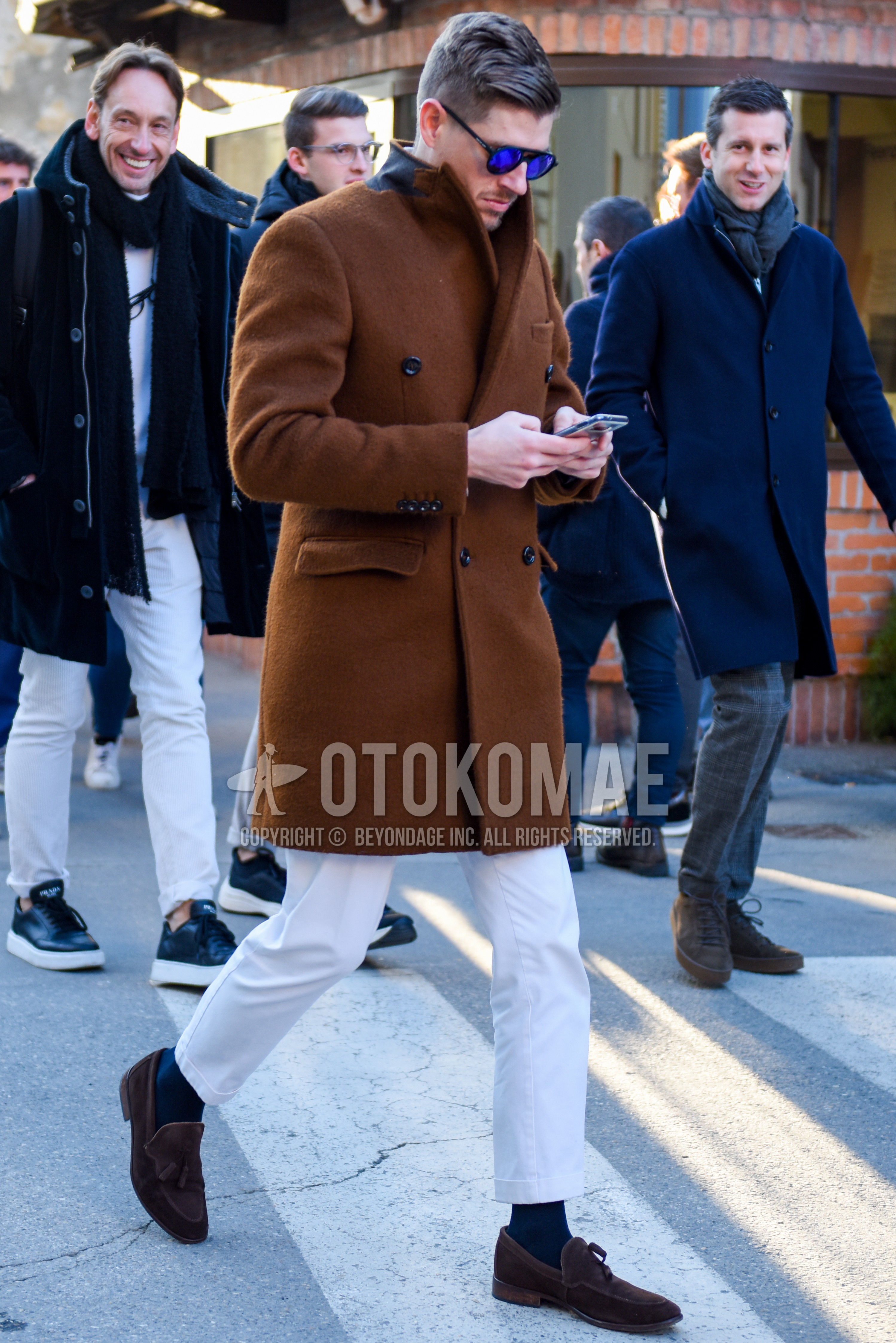 Men's autumn winter outfit with black plain sunglasses, brown plain chester coat, white plain cotton pants, dark gray plain socks, brown tassel loafers leather shoes.
