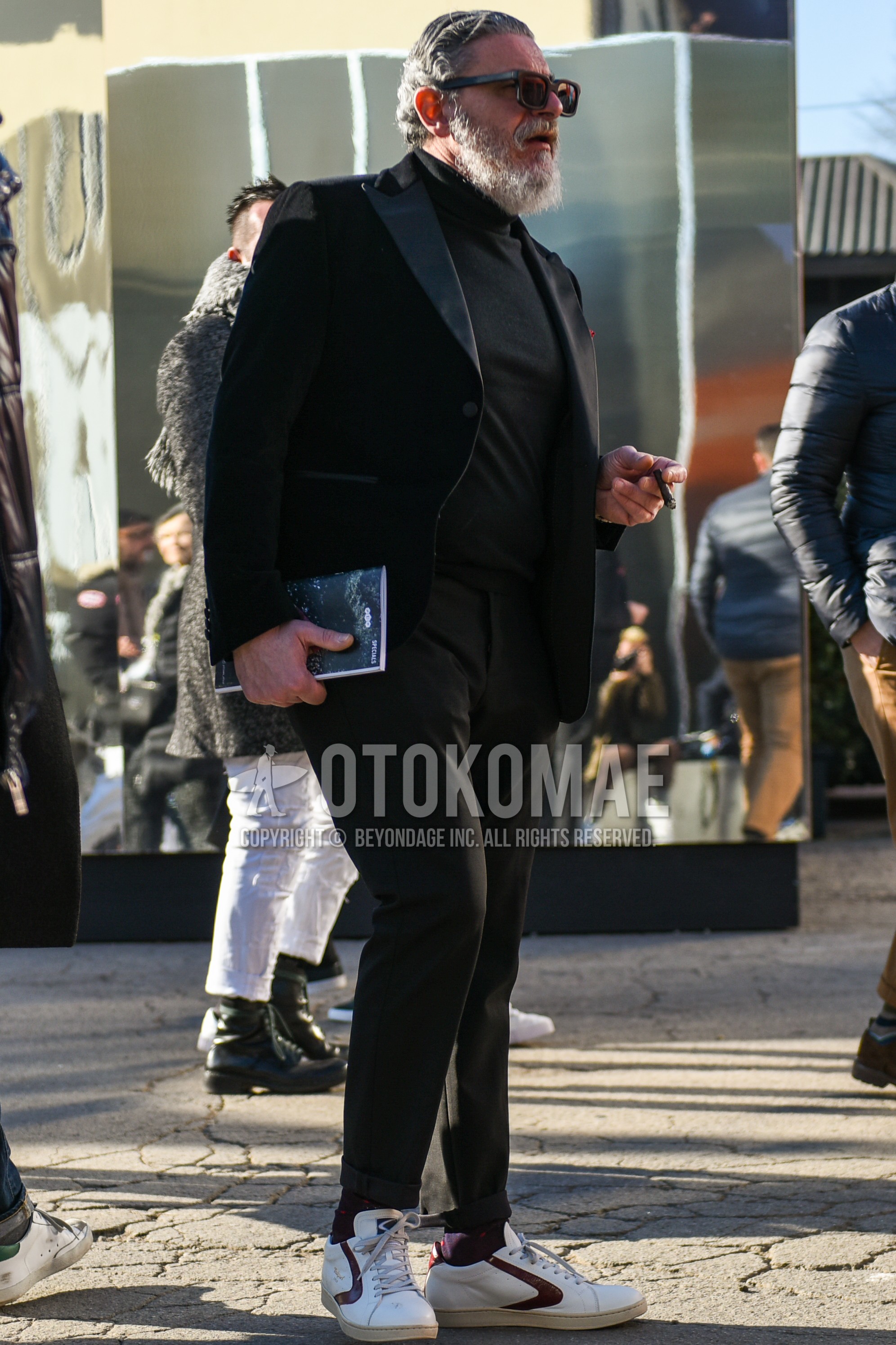 Men's spring autumn outfit with black plain sunglasses, black plain turtleneck knit, black plain socks, white low-cut sneakers, black plain suit.