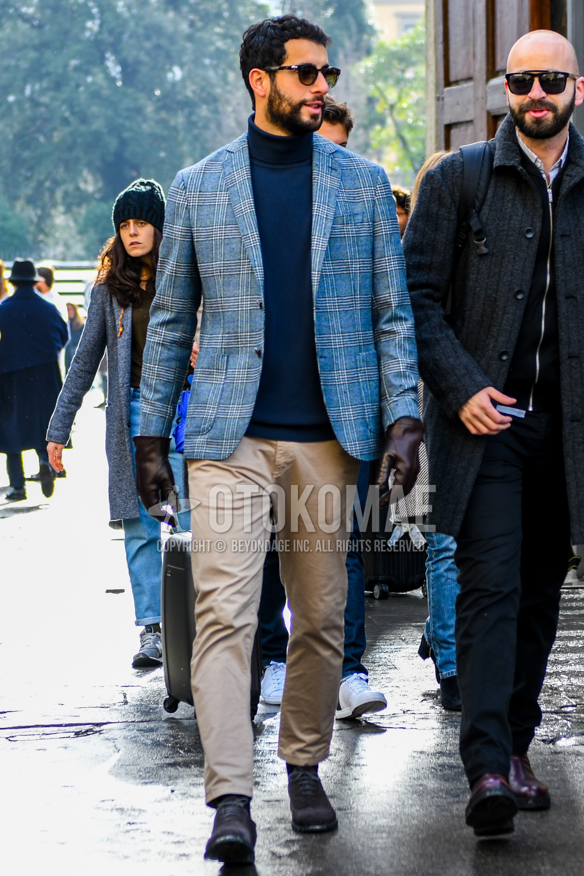 Men's autumn winter outfit with plain sunglasses, check tailored jacket, light blue plain turtleneck knit, beige plain chinos, brown wing-tip shoes leather shoes, suede shoes leather shoes.