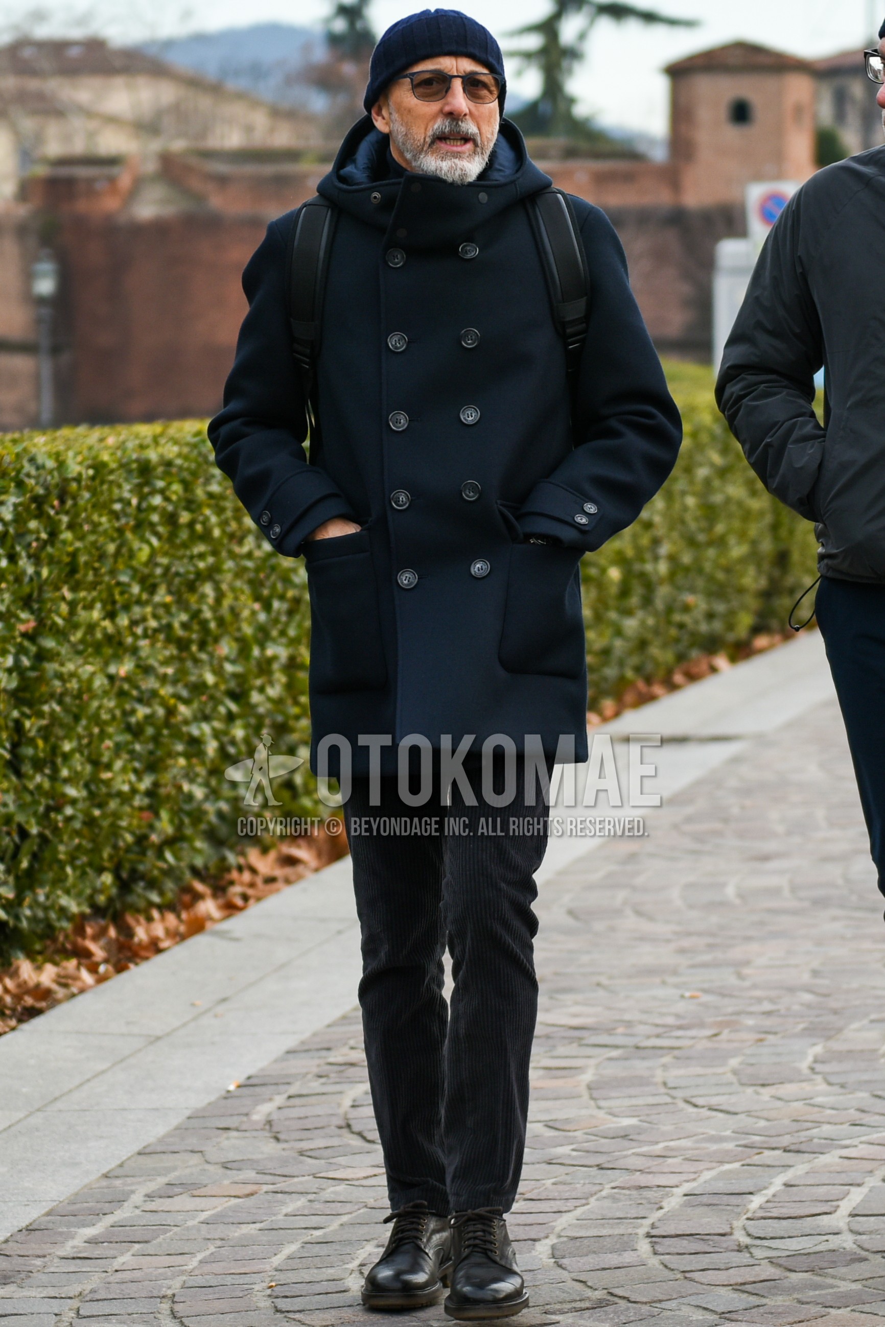 Men's autumn winter outfit with navy plain knit cap, black plain sunglasses, black plain hooded coat, plain winter pants (corduroy,velour), black plain toe leather shoes.