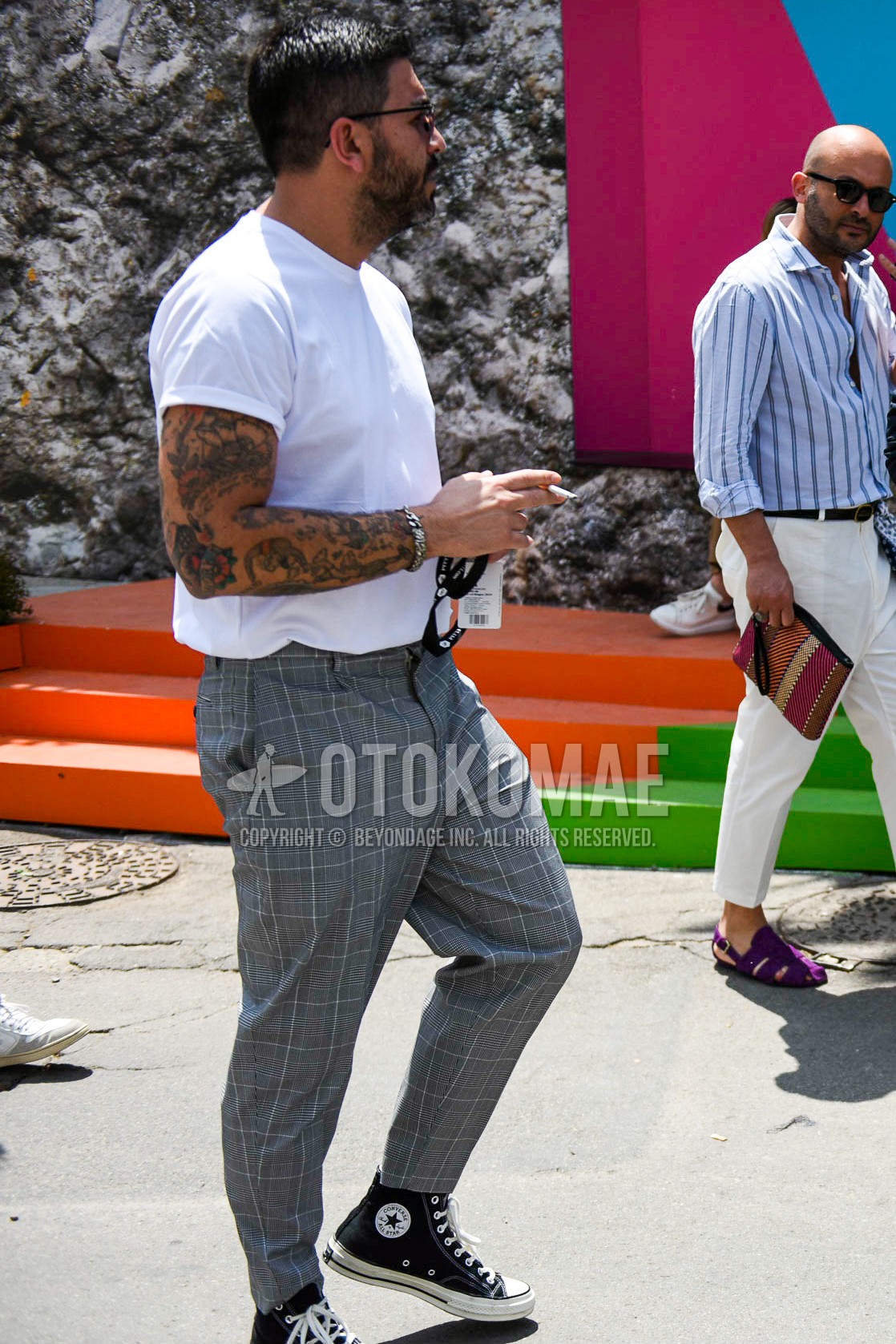 Men's summer outfit with white plain t-shirt, gray check slacks, black high-cut sneakers.