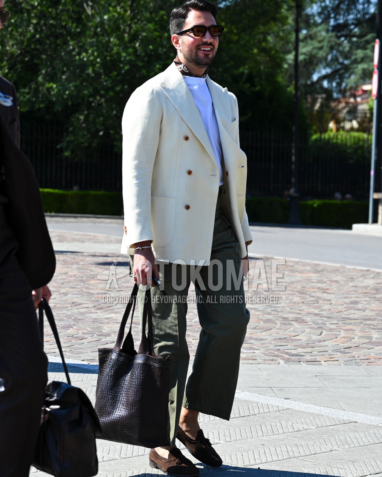 Men's spring summer autumn outfit with black plain sunglasses, white plain tailored jacket, white plain t-shirt, olive green plain cargo pants, brown tassel loafers leather shoes, brown suede shoes leather shoes, black plain tote bag.