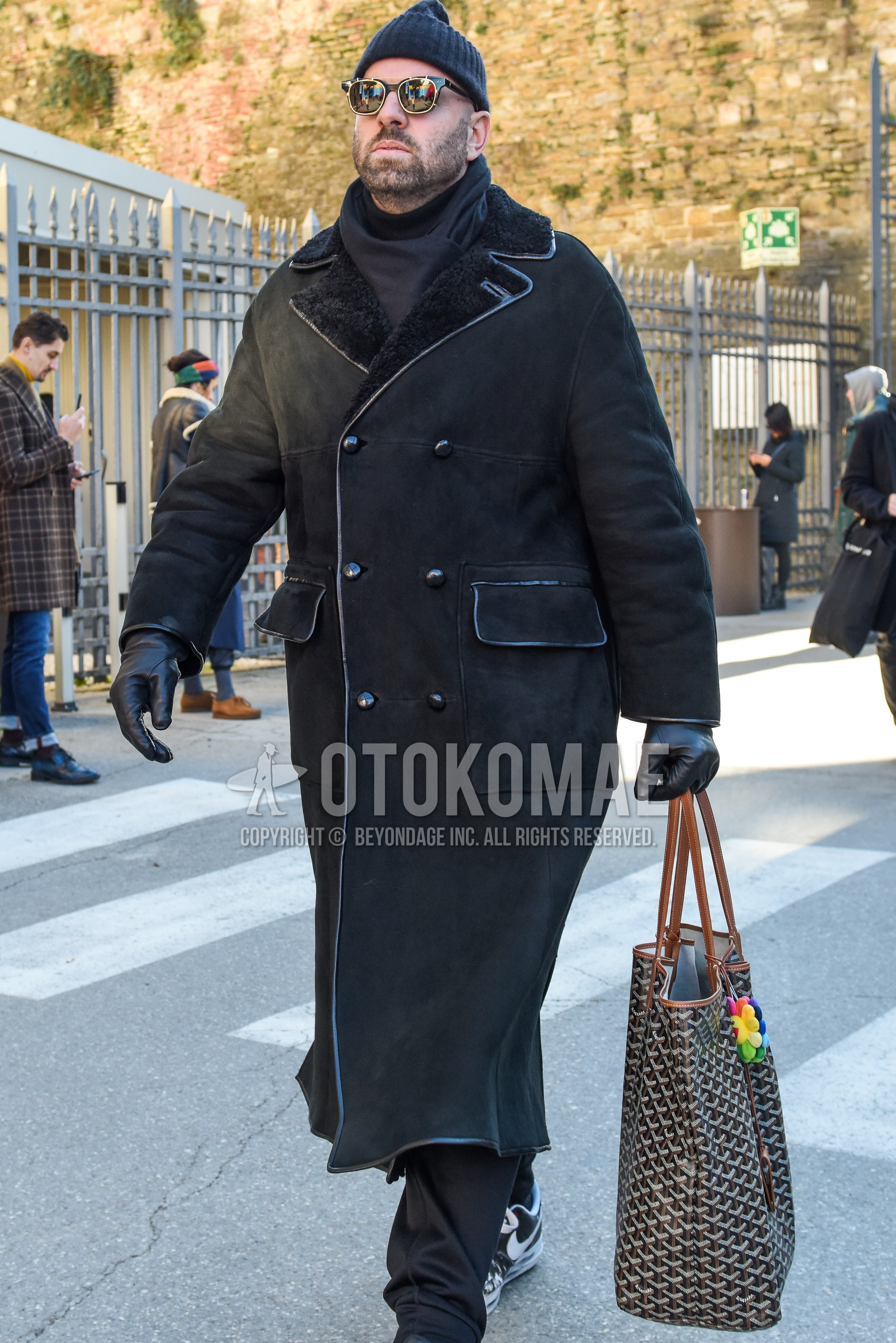 Men's autumn winter outfit with black plain knit cap, black plain sunglasses, gray plain scarf, black plain ulster coat, gray plain slacks, black bag briefcase/handbag.