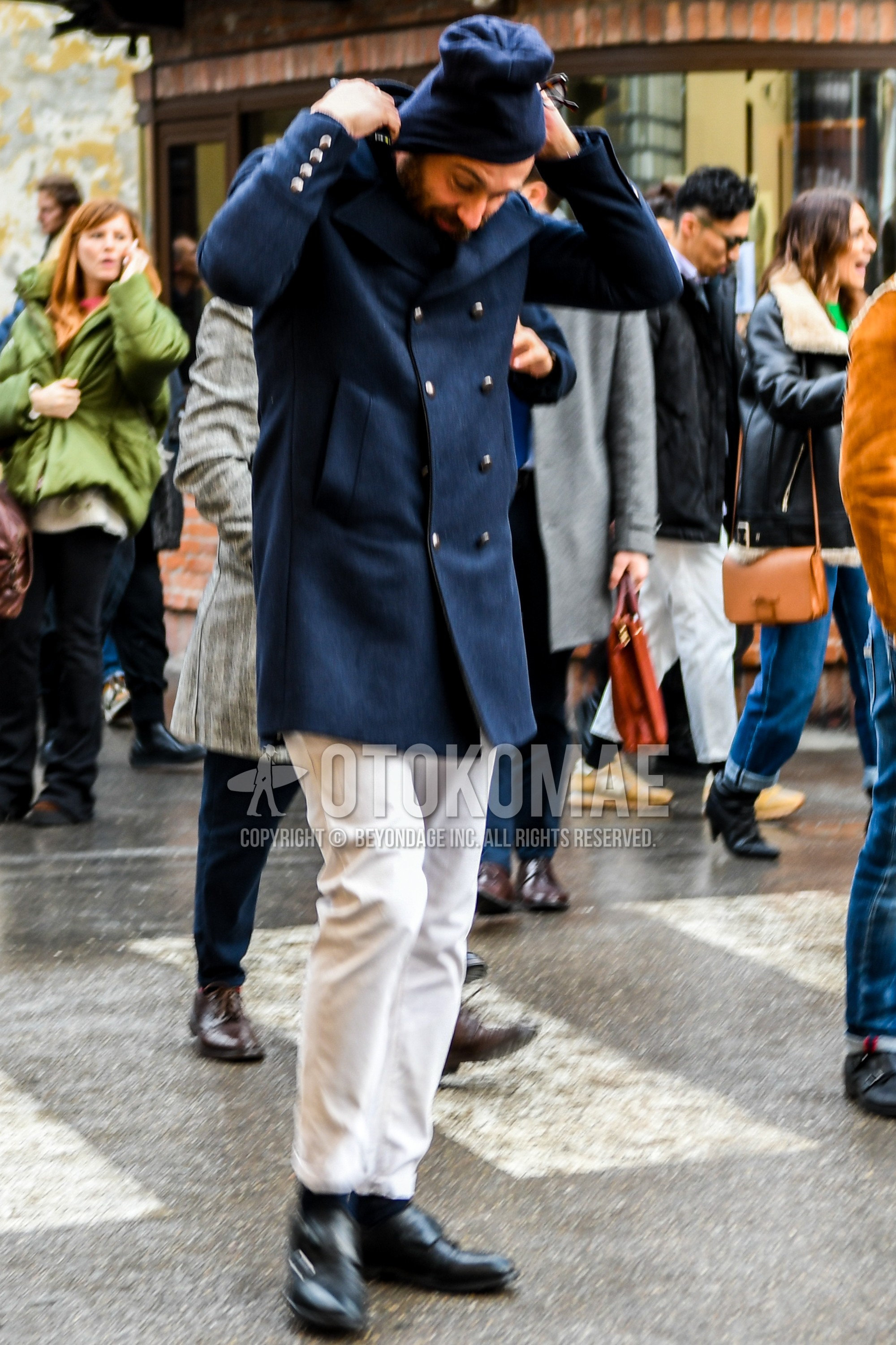 Men's winter outfit with navy plain knit cap, navy plain p coat, white plain cotton pants, black plain socks, black monk shoes leather shoes.