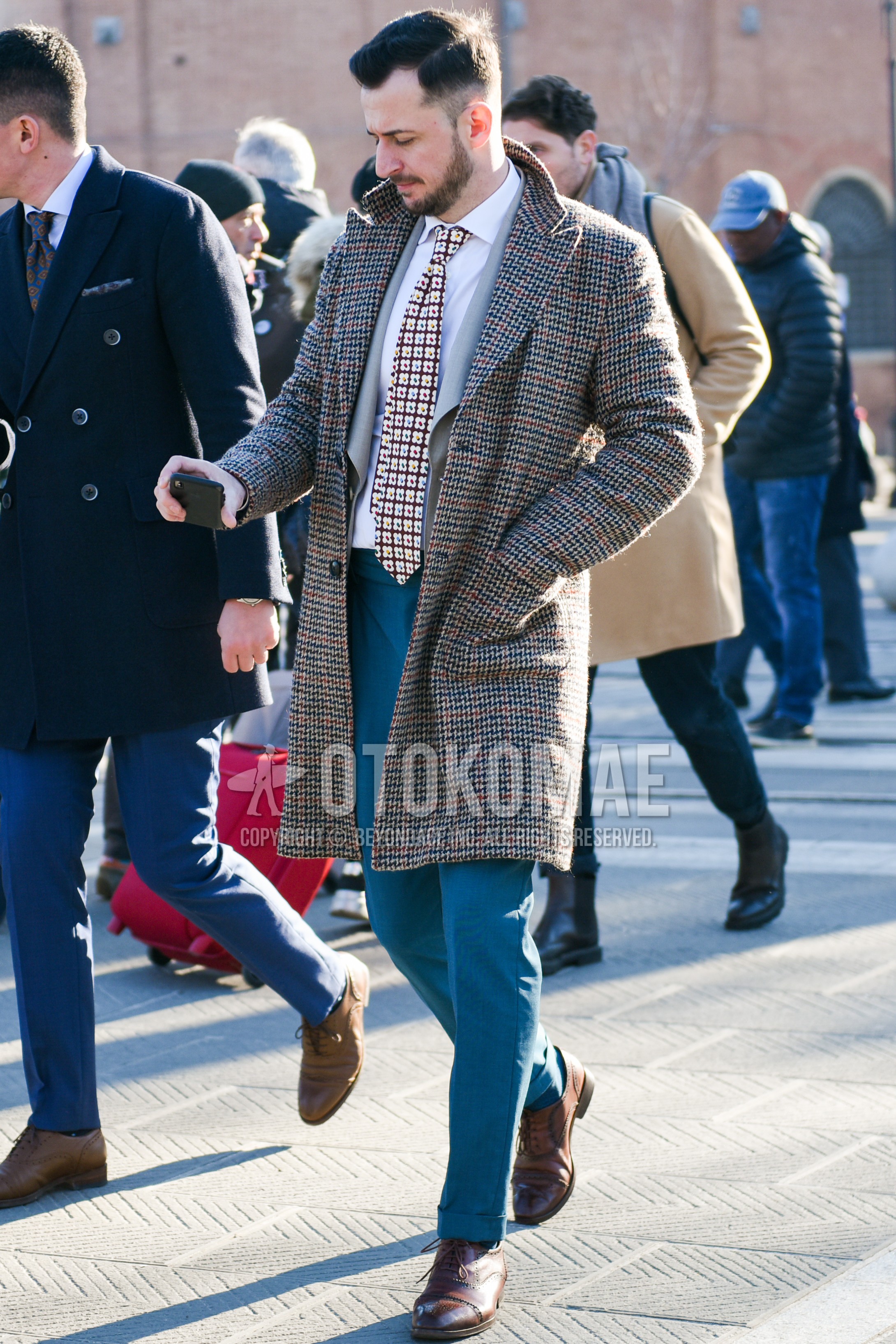 Men's autumn winter outfit with gray check chester coat, white plain shirt, gray plain tailored jacket, gray plain slacks, brown brogue shoes leather shoes, brown necktie necktie.