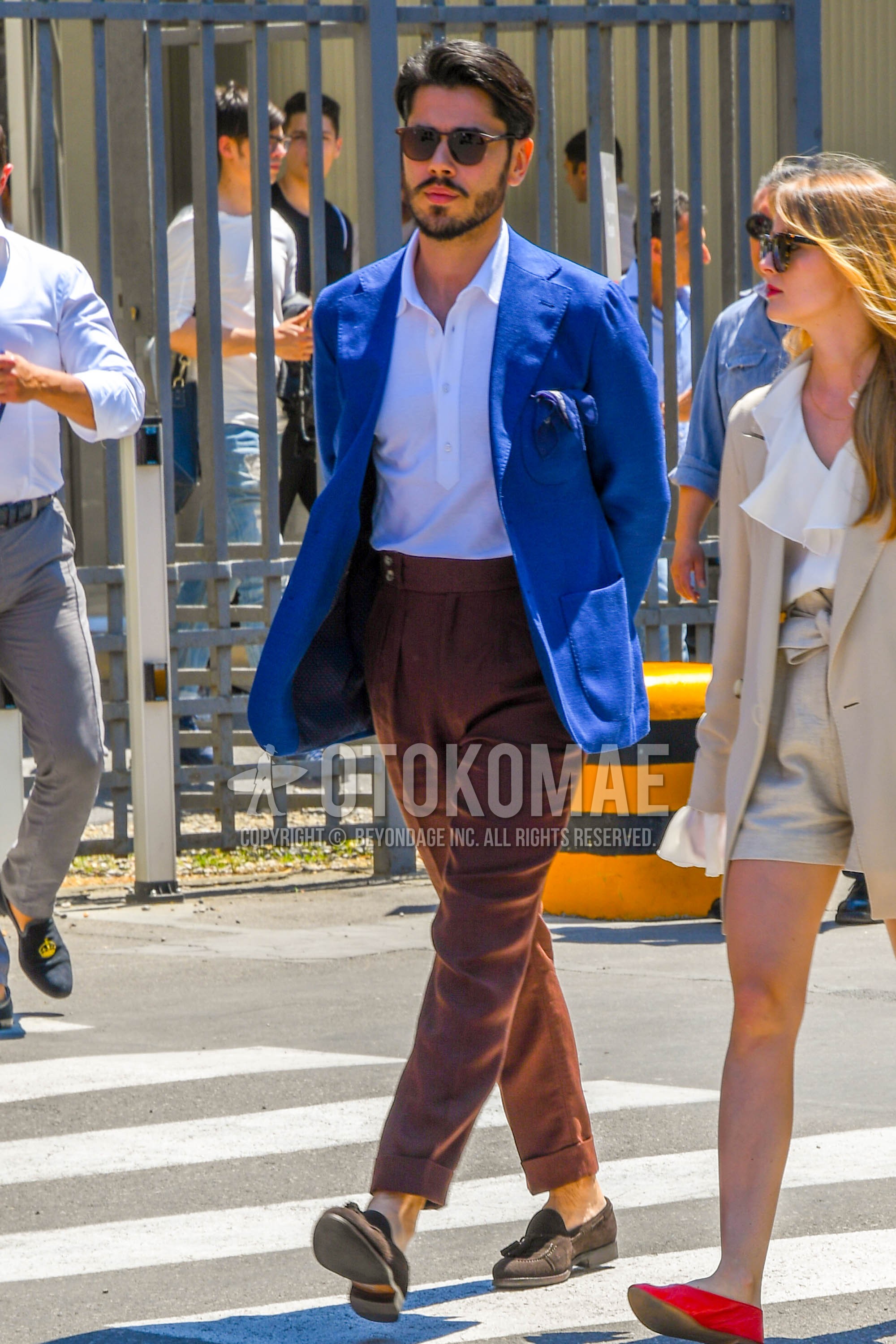 Men's spring summer autumn outfit with brown tortoiseshell sunglasses, blue plain tailored jacket, white plain polo shirt, brown plain pleated pants, brown plain ankle pants, brown plain beltless pants, brown tassel loafers leather shoes.