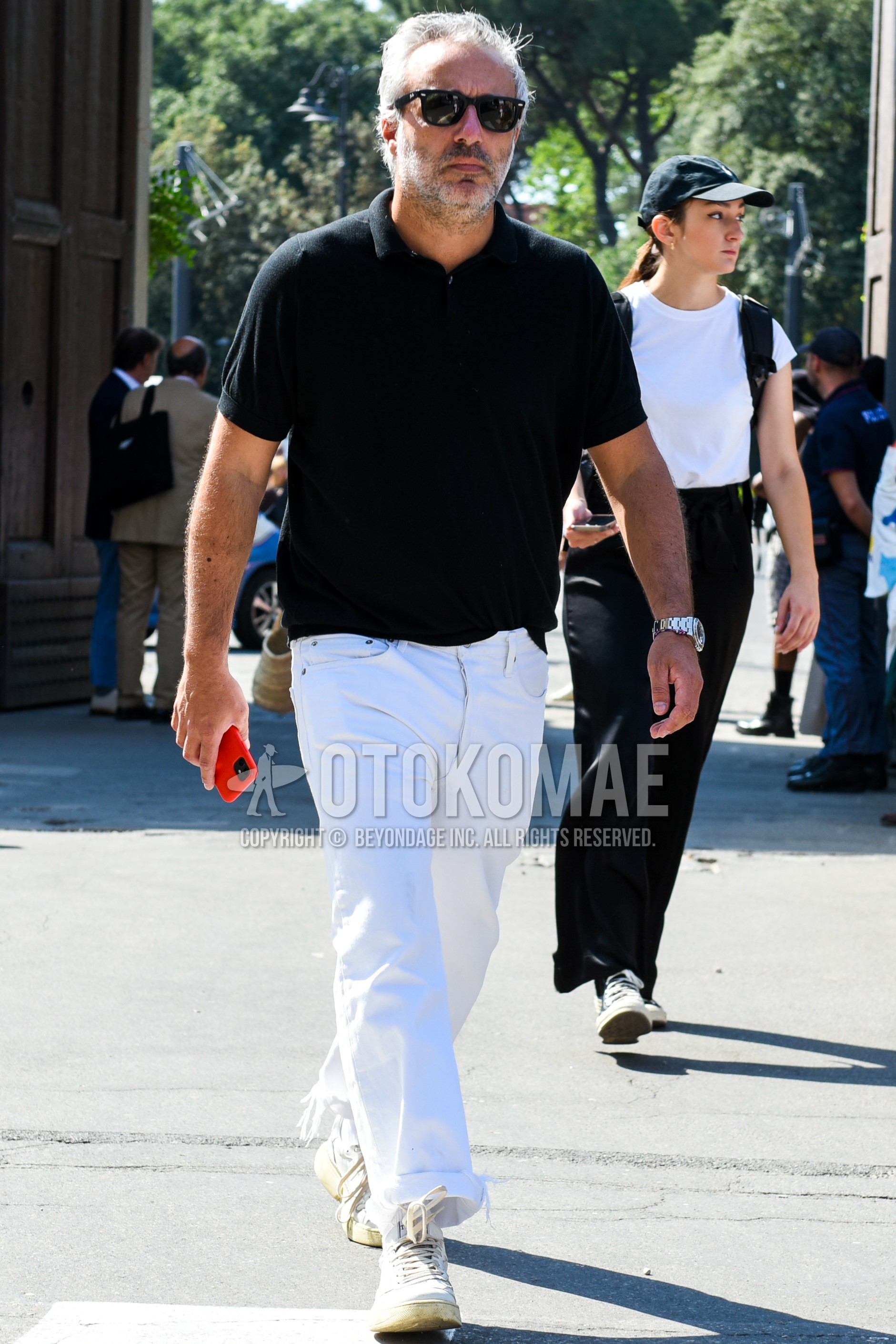 Men's summer outfit with black plain sunglasses, black plain polo shirt, white plain denim/jeans, white high-cut sneakers.