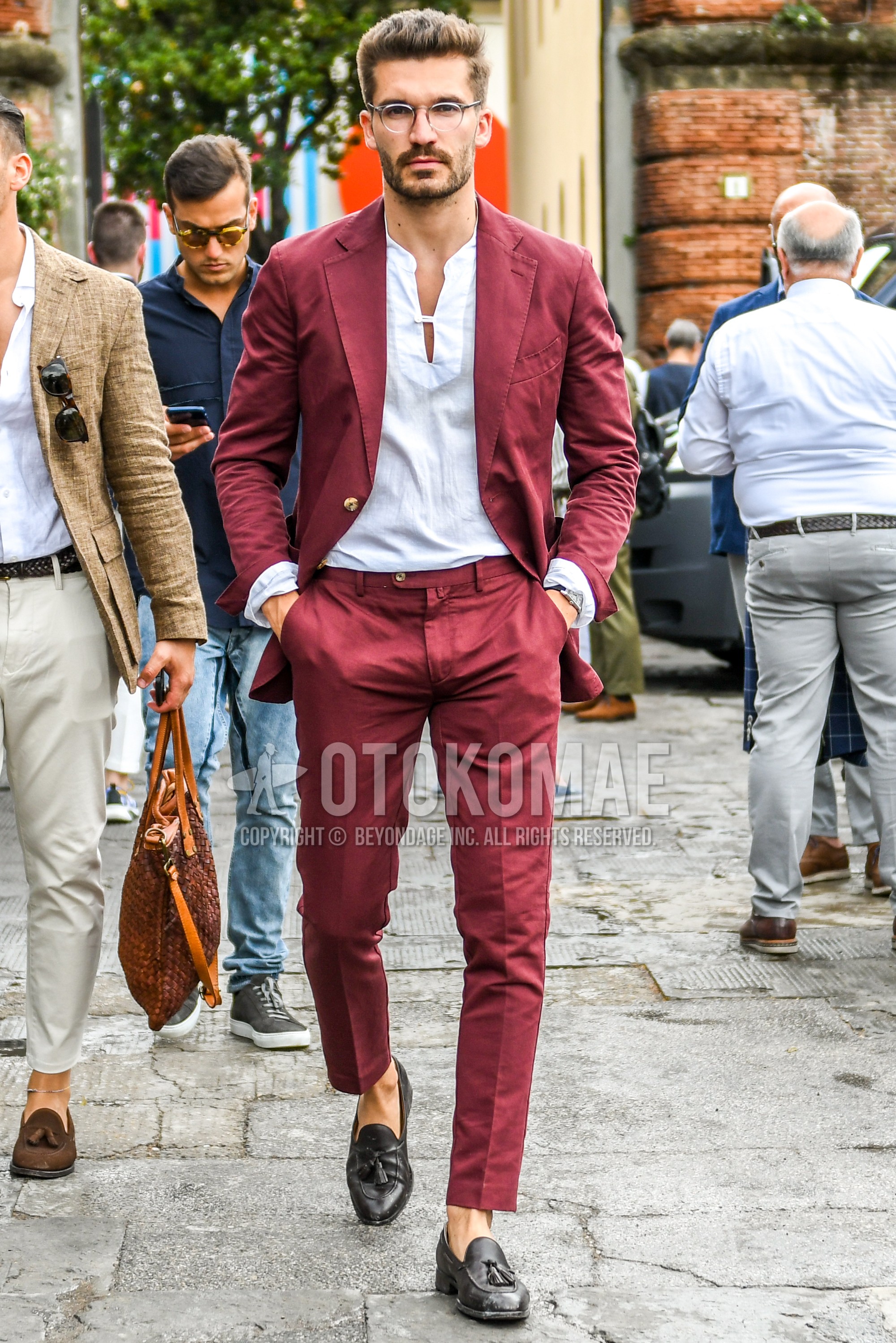 Men's spring summer autumn outfit with clear plain glasses, white plain shirt, brown tassel loafers leather shoes, red plain suit.