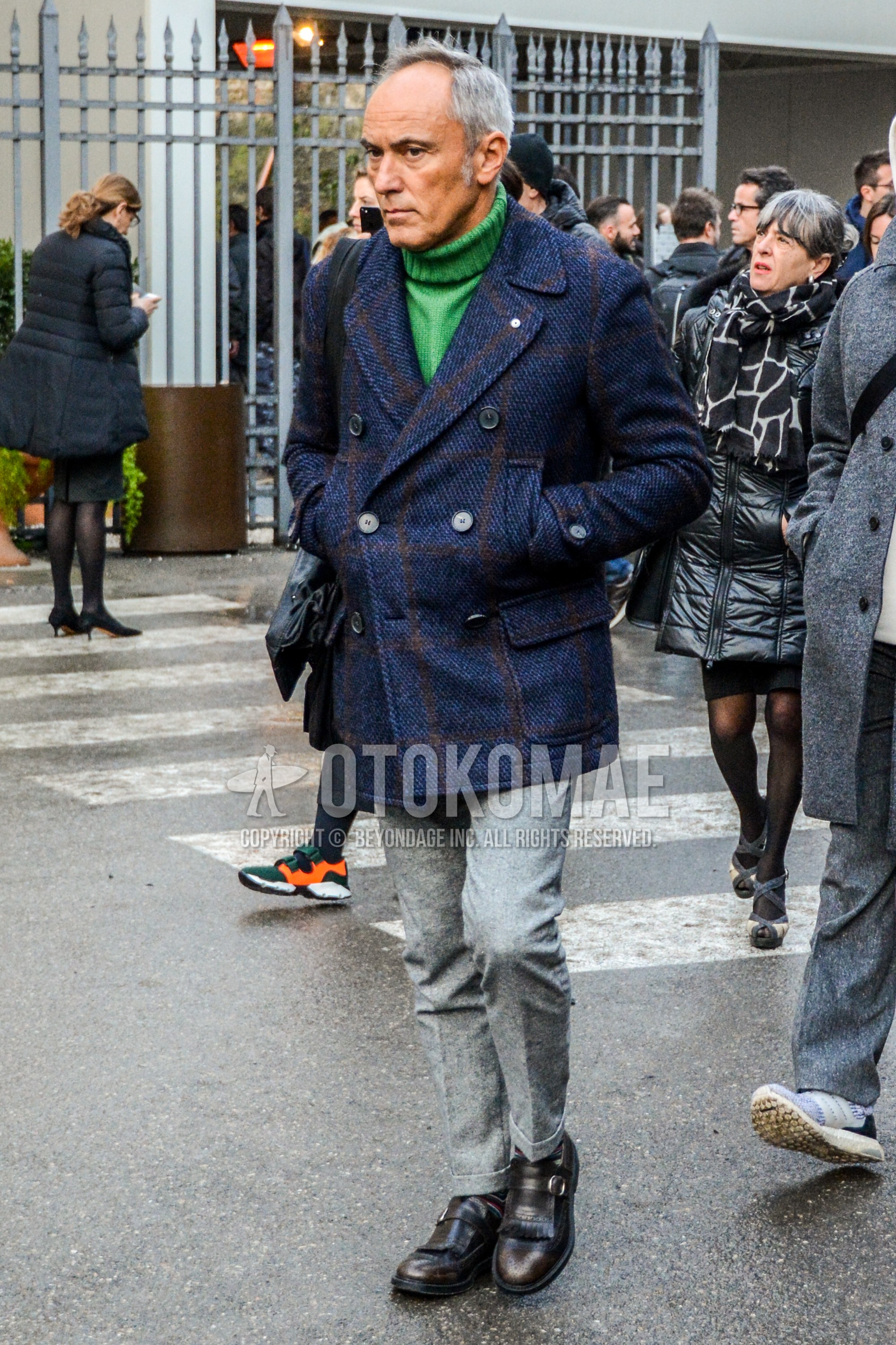 Men's winter outfit with navy check p coat, green plain turtleneck knit, gray plain slacks, brown  loafers leather shoes.