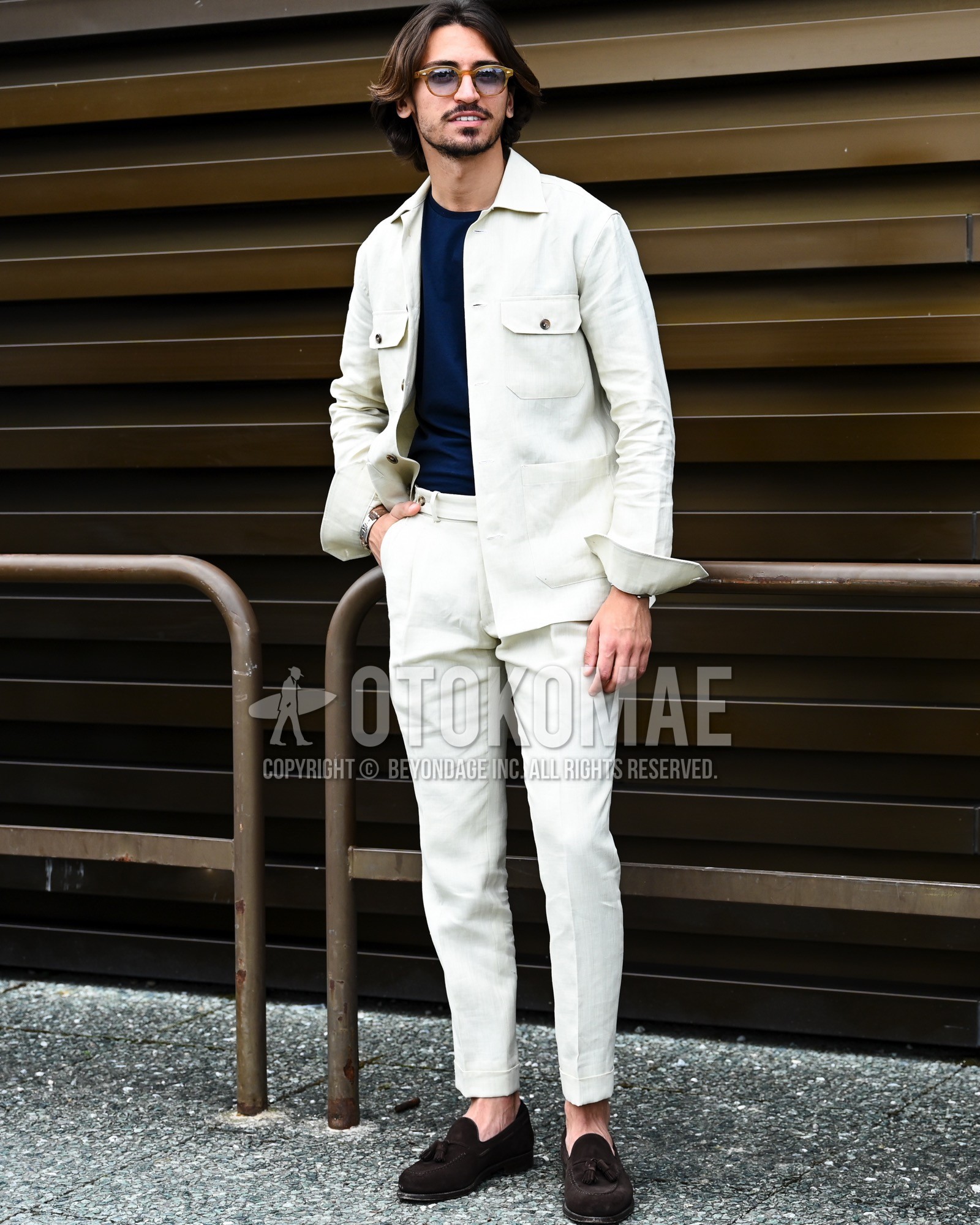 Men's spring summer autumn outfit with black plain sunglasses, white plain shirt jacket, navy plain t-shirt, white plain beltless pants, brown tassel loafers leather shoes, brown suede shoes leather shoes.