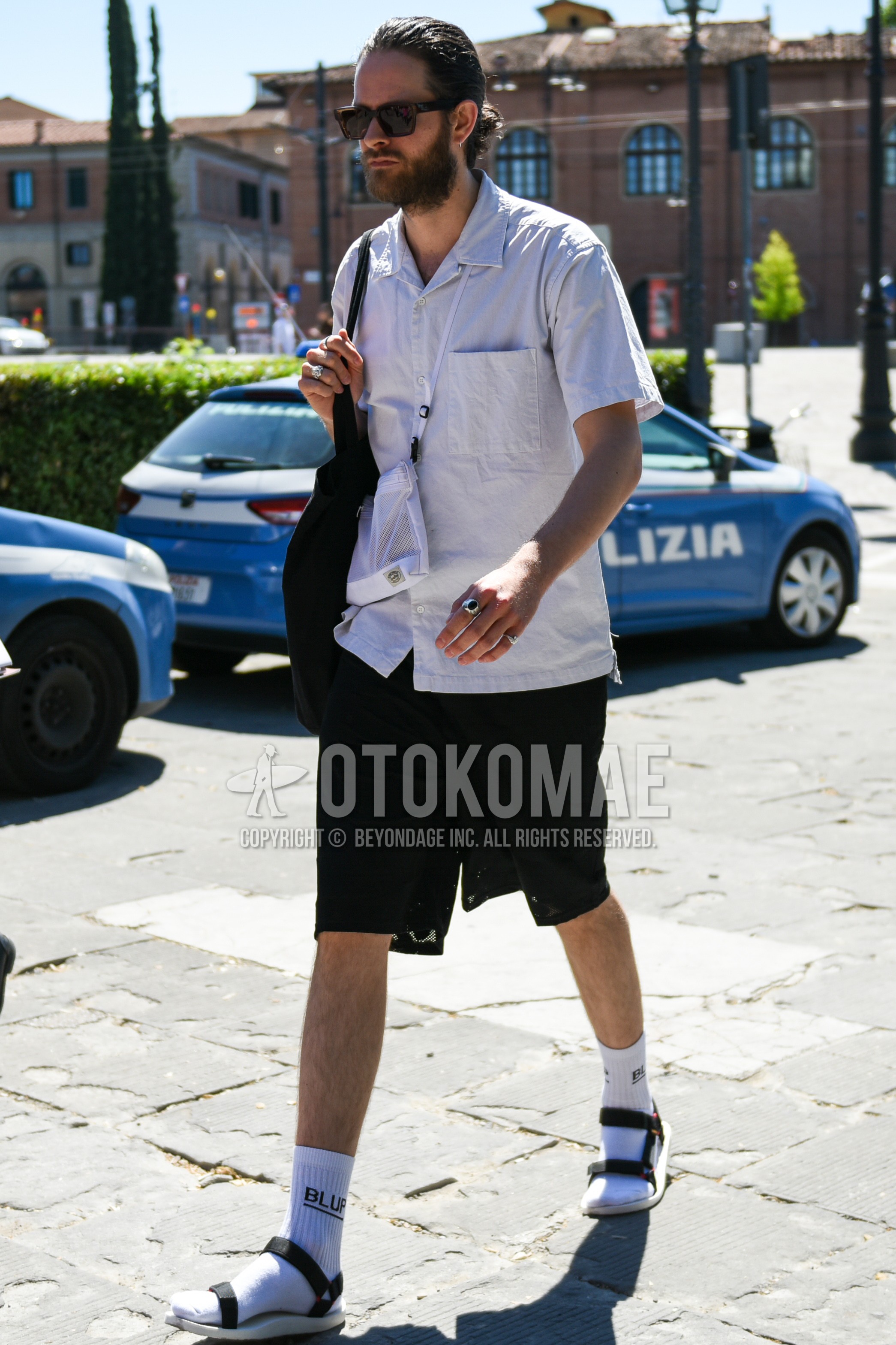 Men's summer outfit with brown plain sunglasses, white plain shirt, white one point socks, black white sport sandals, white plain succoshe.