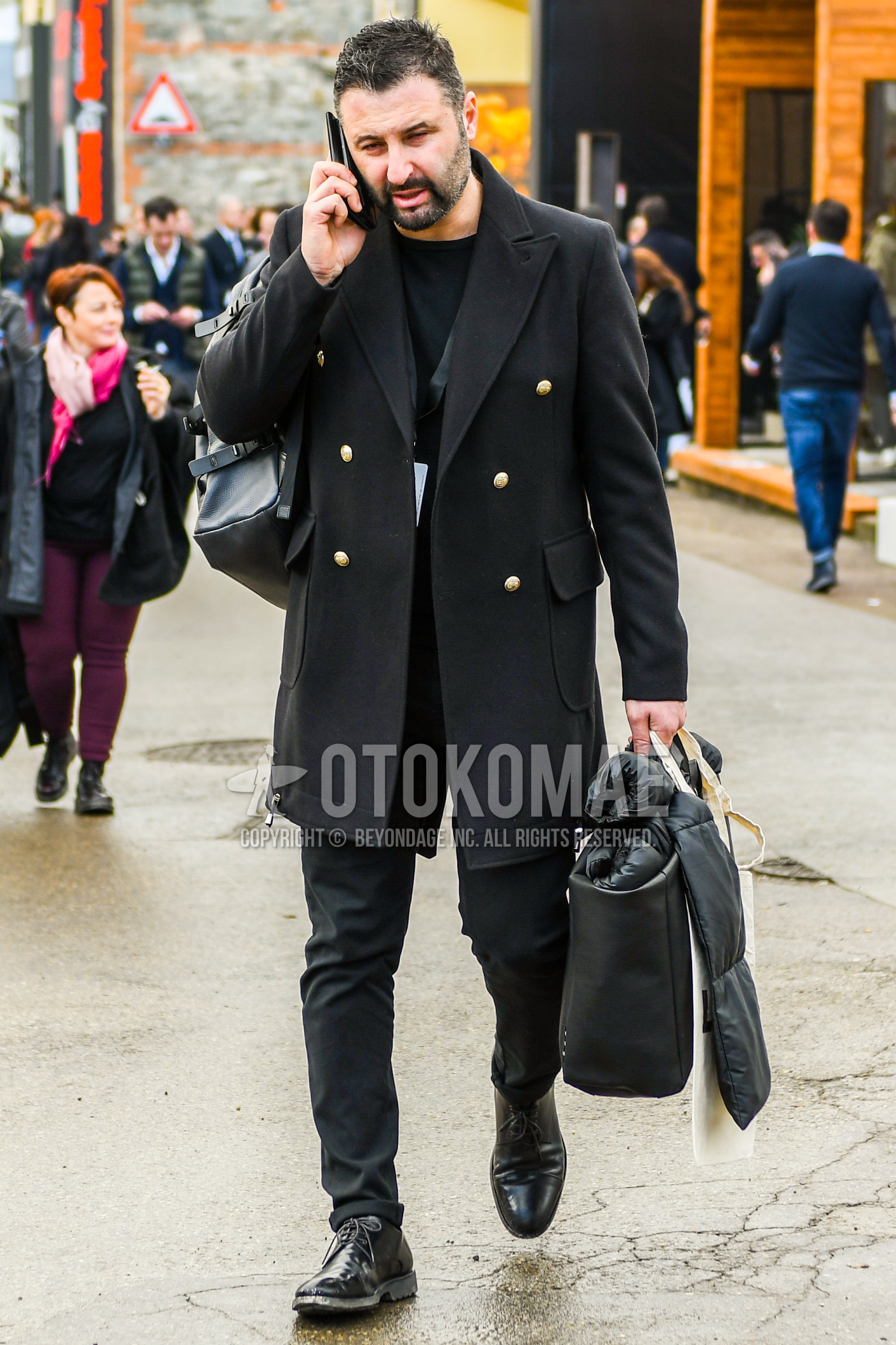 Men's autumn winter outfit with black plain chester coat, black plain sweatshirt, black straight-tip shoes leather shoes, black plain briefcase/handbag, gray plain suit.