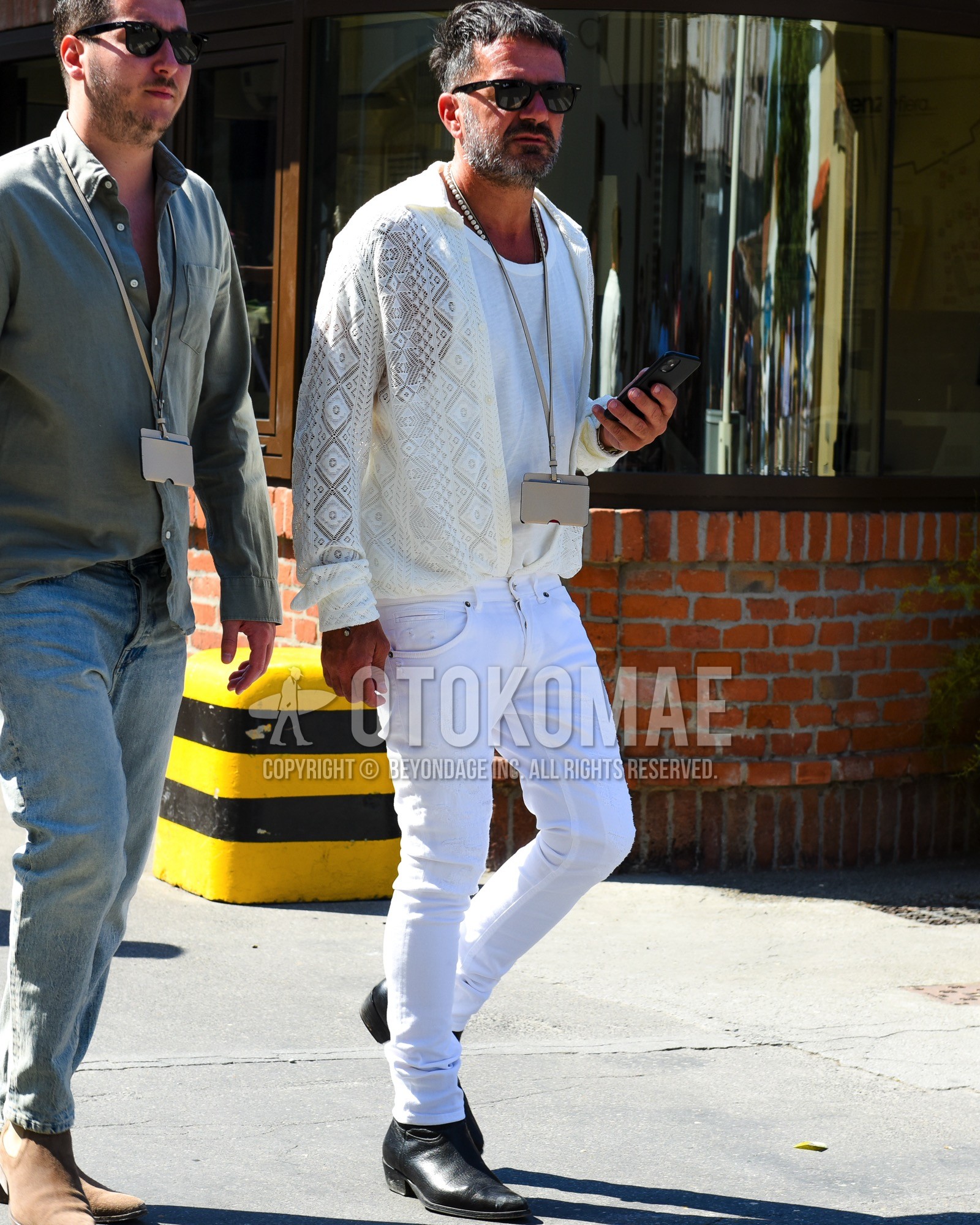 Men's spring summer outfit with black plain sunglasses, white plain t-shirt, white plain cardigan, white plain cotton pants, white plain skinny pants, black  boots.