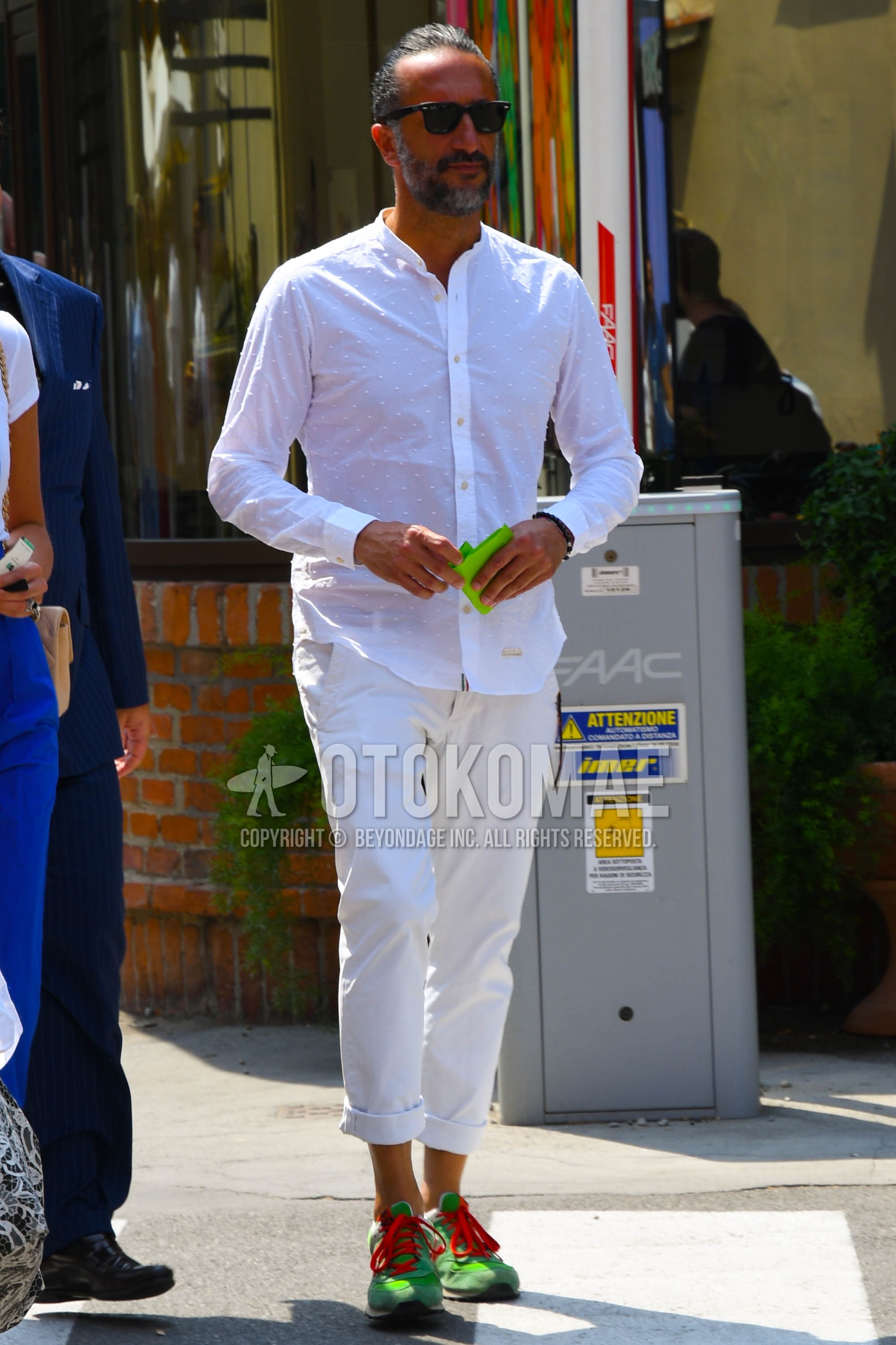 Men's spring summer outfit with plain sunglasses, white plain shirt, white plain cotton pants, green low-cut sneakers.