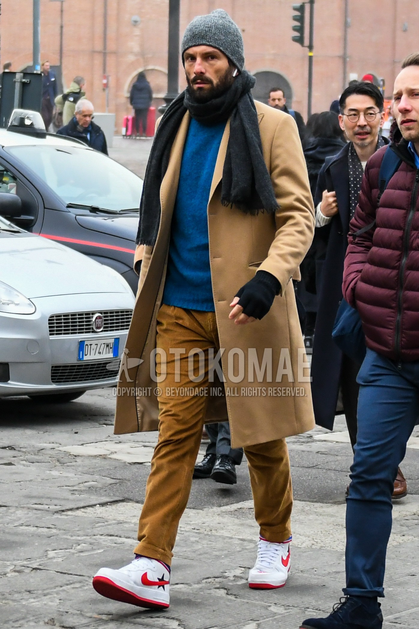Men's winter outfit with gray plain knit cap, dark gray plain scarf, brown plain chester coat, blue plain sweater, brown plain winter pants (corduroy,velour), white high-cut sneakers.