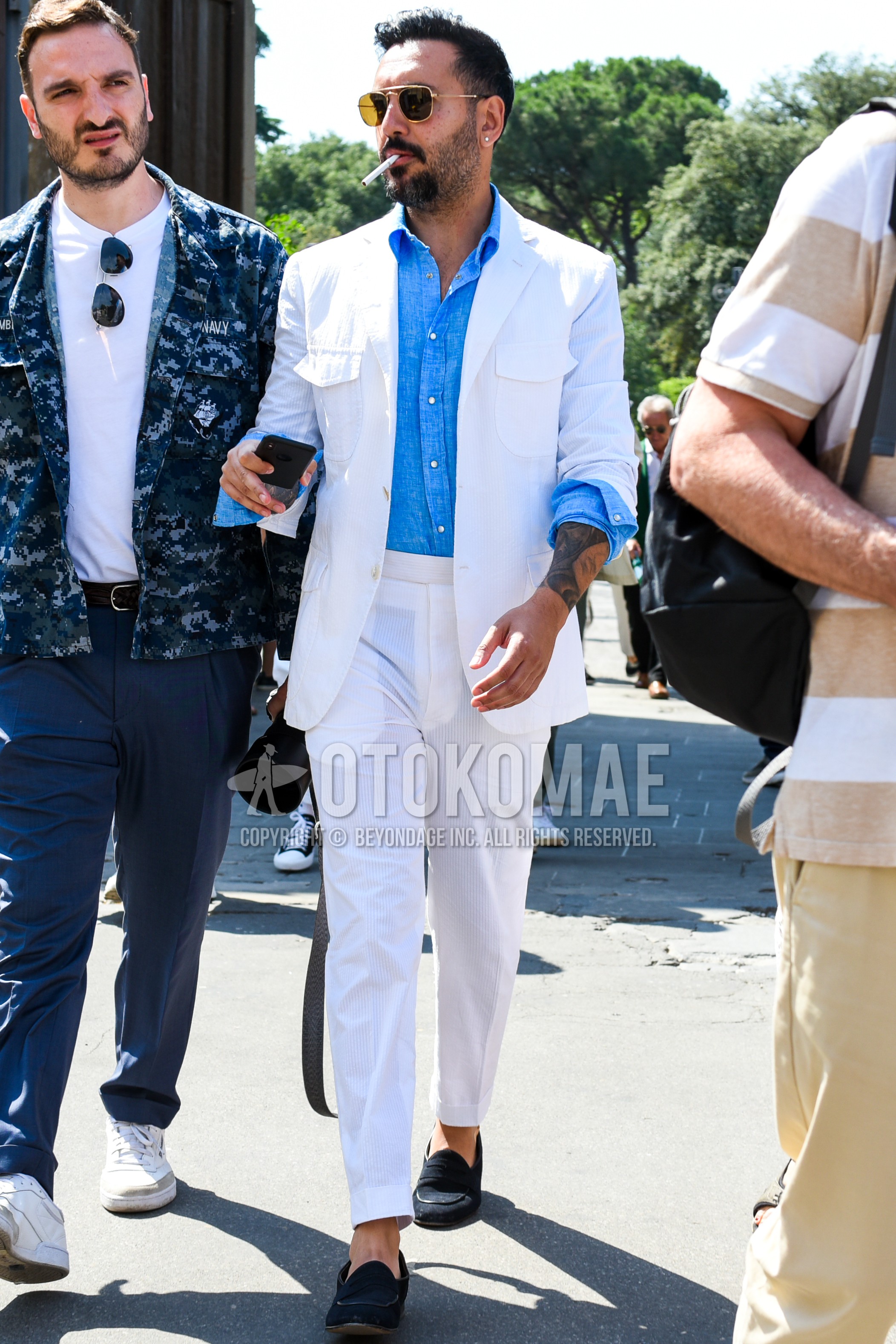 Men's spring summer autumn outfit with yellow plain sunglasses, white plain field jacket/hunting jacket, light blue plain shirt, white plain slacks, white plain beltless pants, black coin loafers leather shoes.