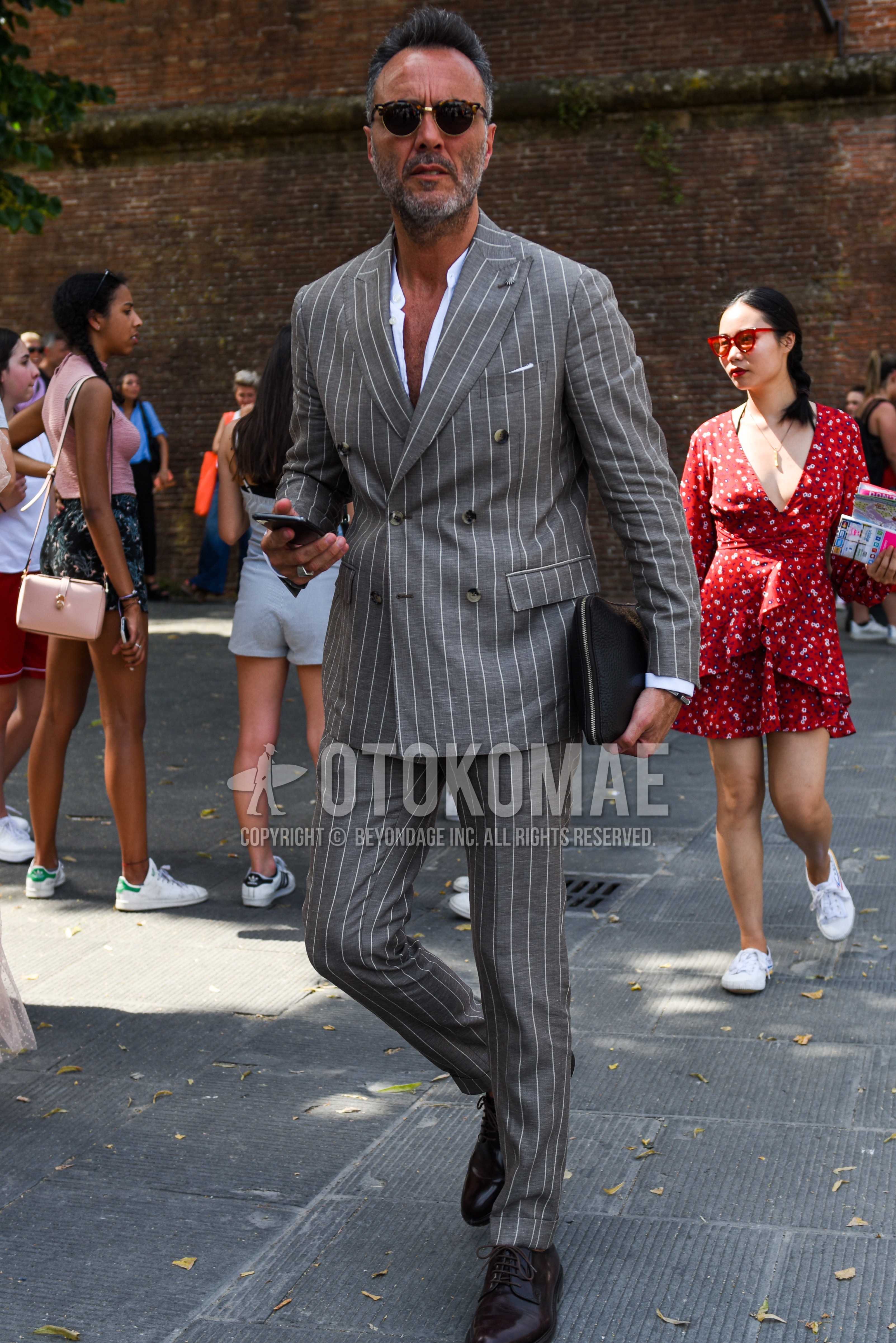 Men's spring summer autumn outfit with brown black tortoiseshell sunglasses, white plain shirt, brown plain toe leather shoes, gray stripes suit.
