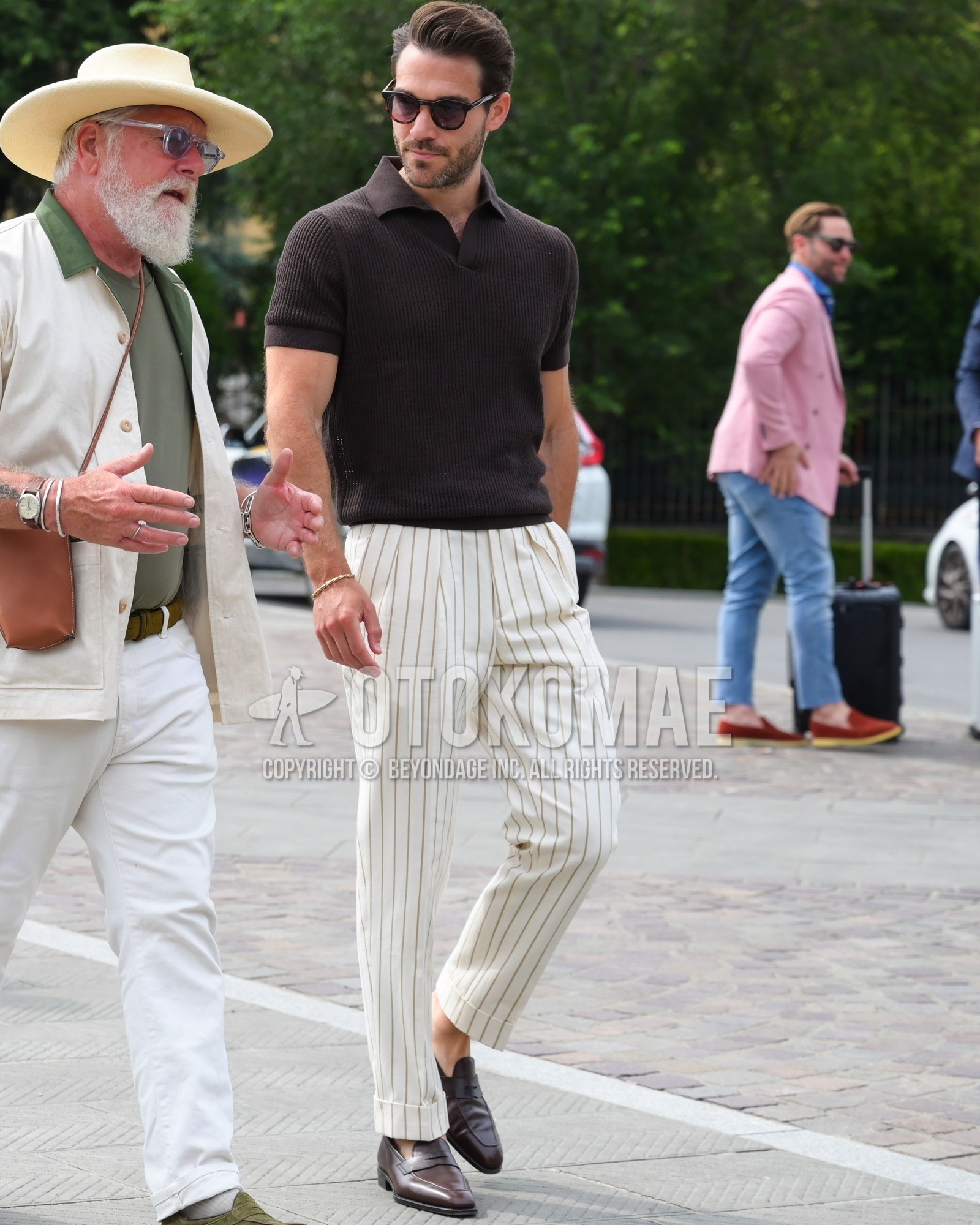 Men's spring summer outfit with brown plain sunglasses, brown plain polo shirt, white stripes pleated pants, brown coin loafers leather shoes.
