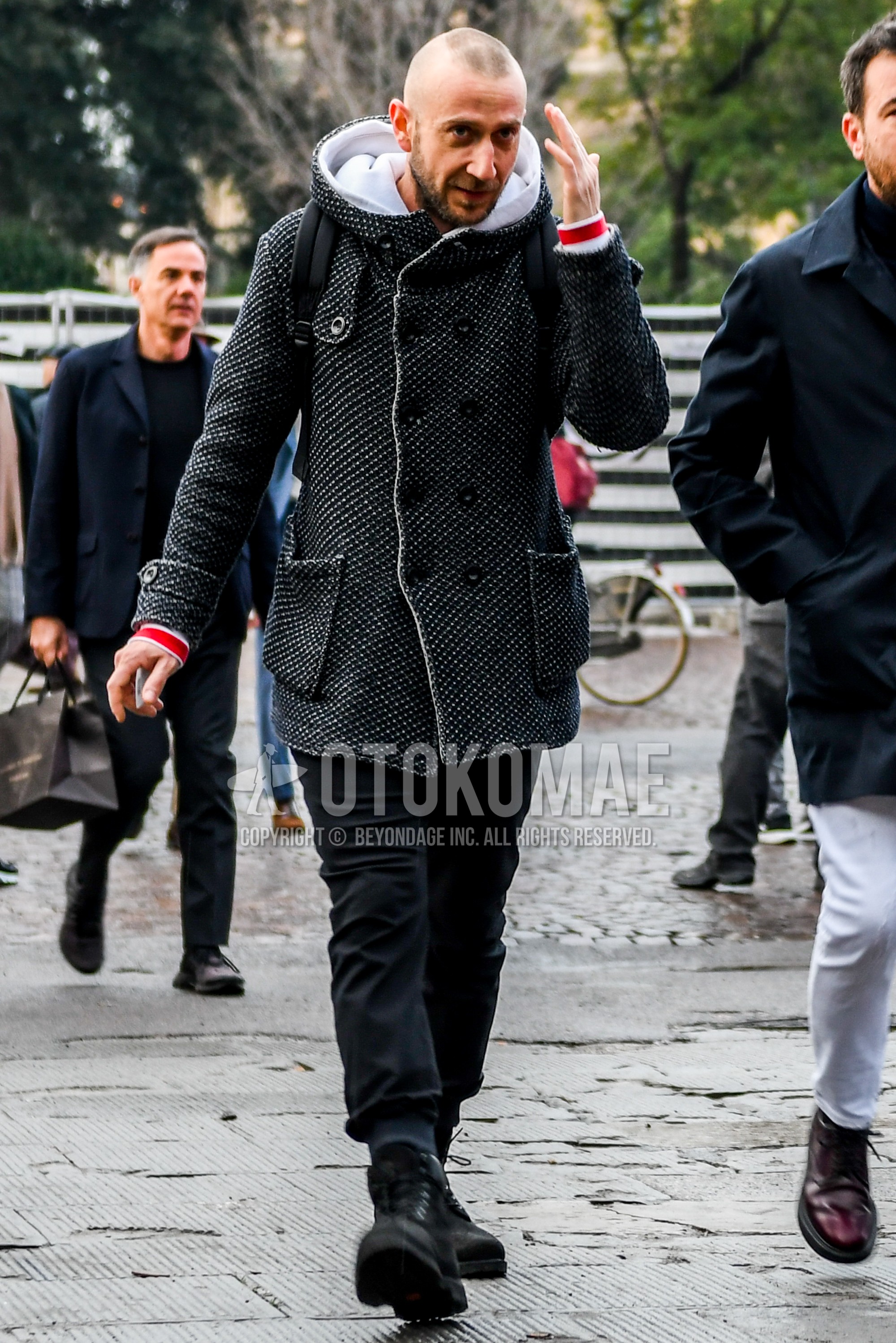 Men's autumn winter outfit with white black plain hooded coat, black plain jogger pants/ribbed pants, black  boots.