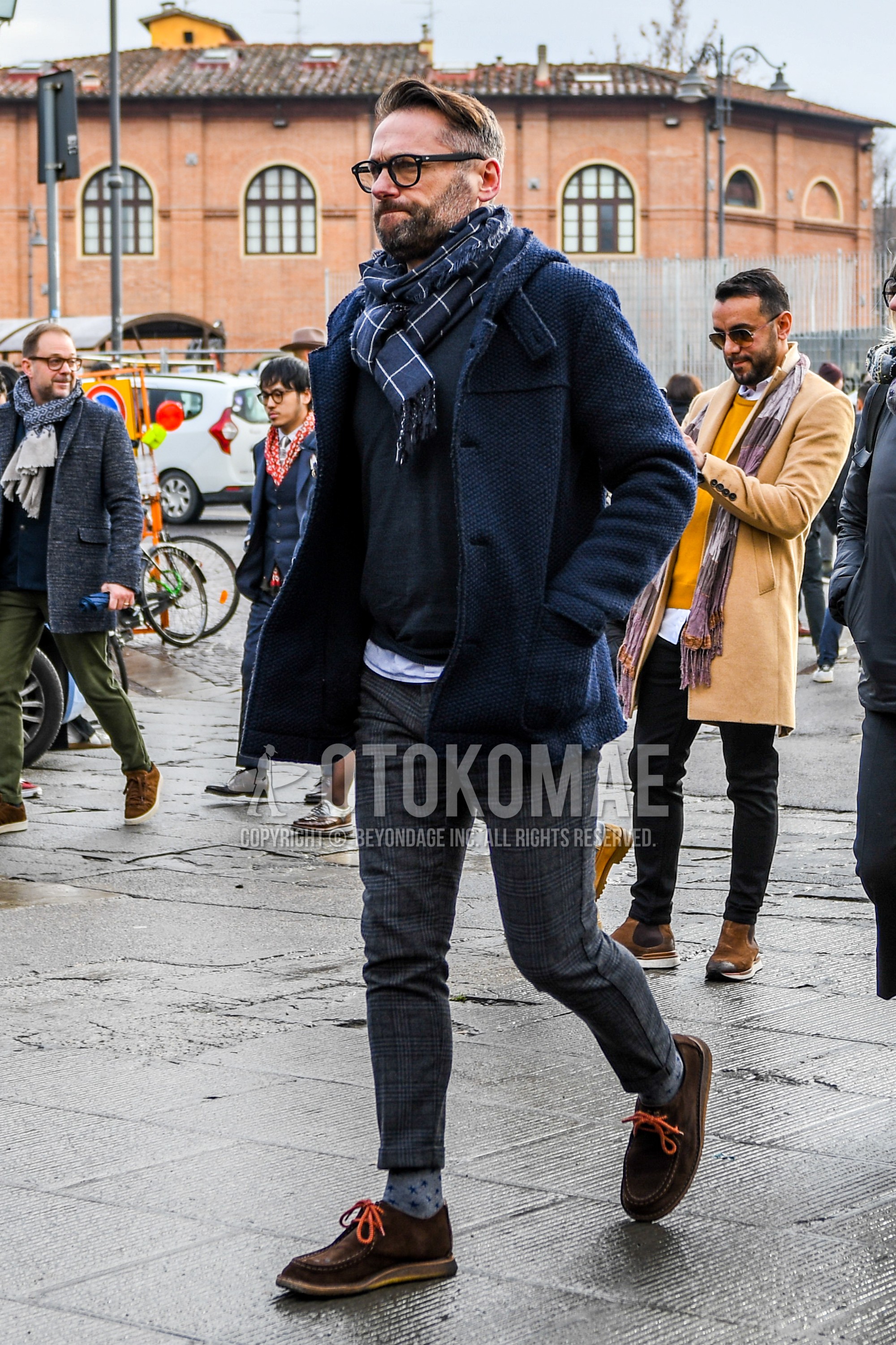 Men's autumn winter outfit with plain glasses, navy check scarf, navy outerwear hooded coat, gray plain sweater, gray check slacks, gray socks socks, brown  boots, suede shoes leather shoes.