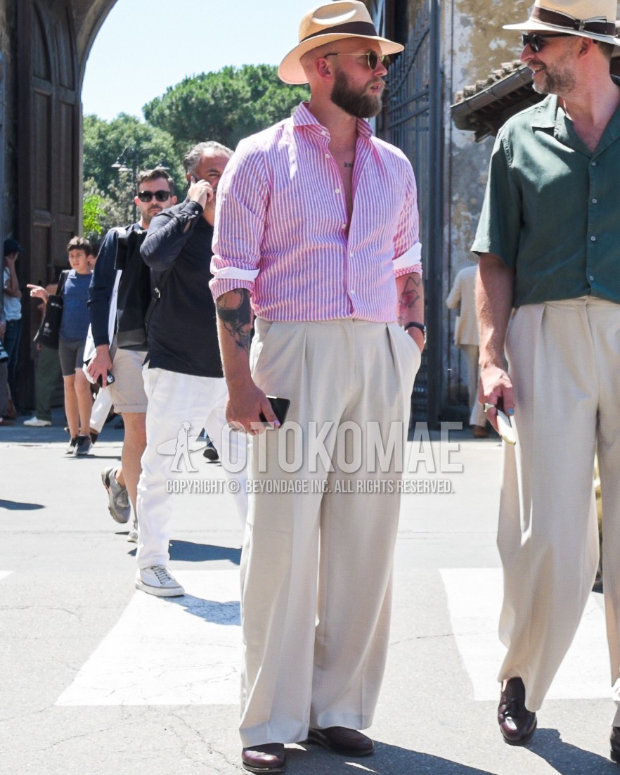 Men's spring summer outfit with beige plain hat, gold plain sunglasses, pink stripes shirt, white plain slacks, white plain wide pants, white plain pleated pants, brown leather shoes.