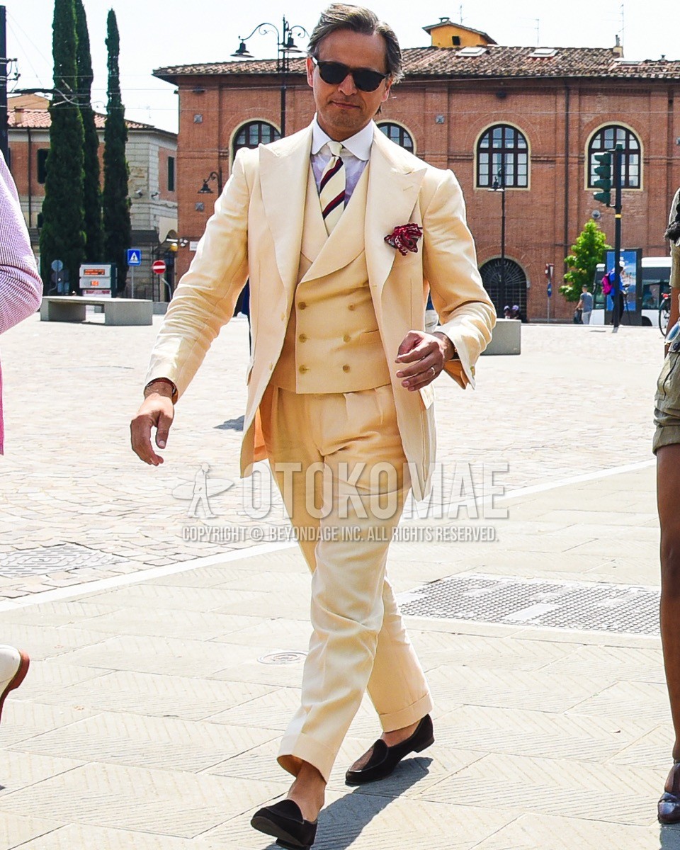 Men's spring summer outfit with brown plain sunglasses, white plain shirt, brown  loafers leather shoes, yellow plain three-piece suit, white regimental necktie.