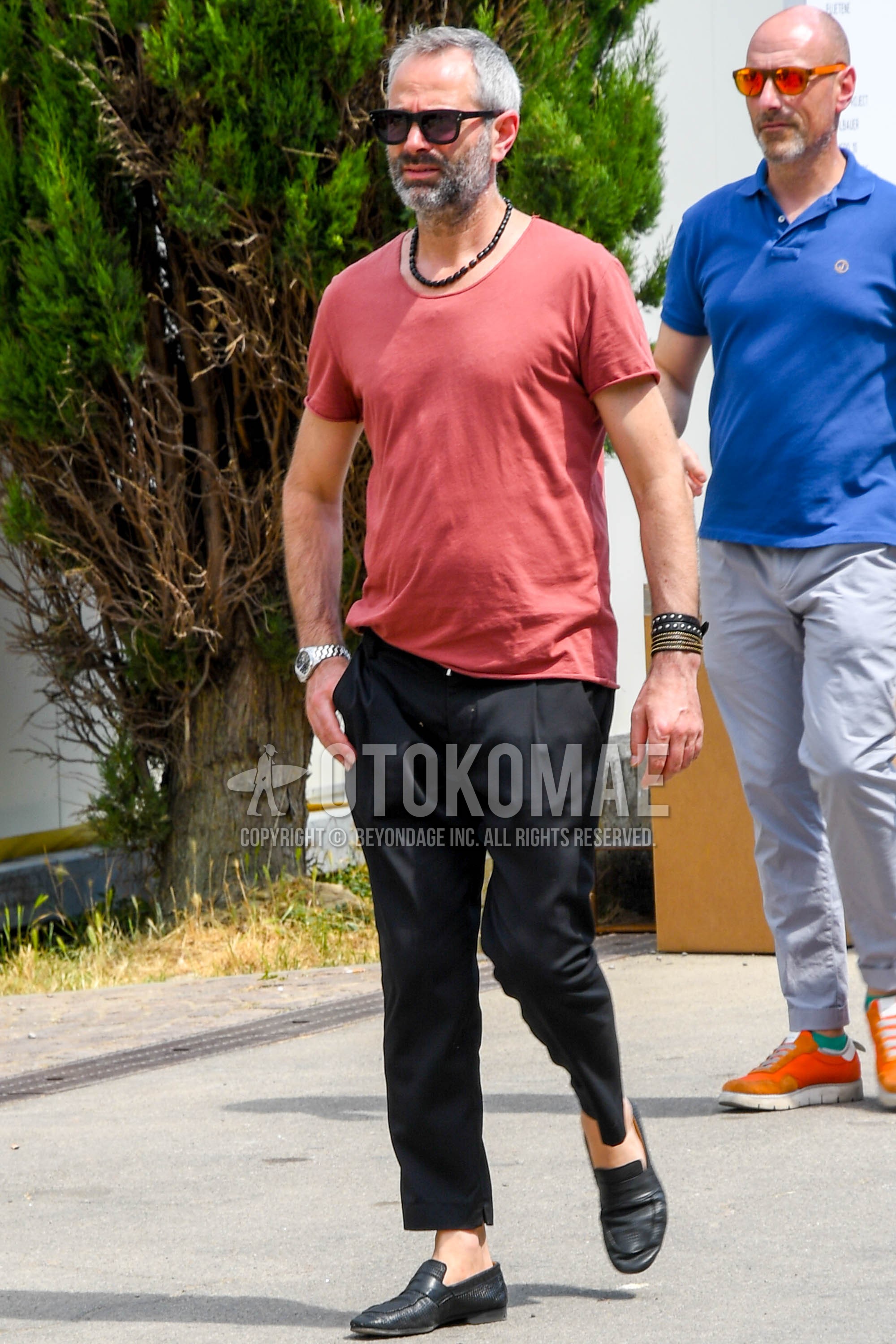 Men's summer outfit with plain sunglasses, red plain t-shirt, black plain ankle pants, black coin loafers leather shoes.