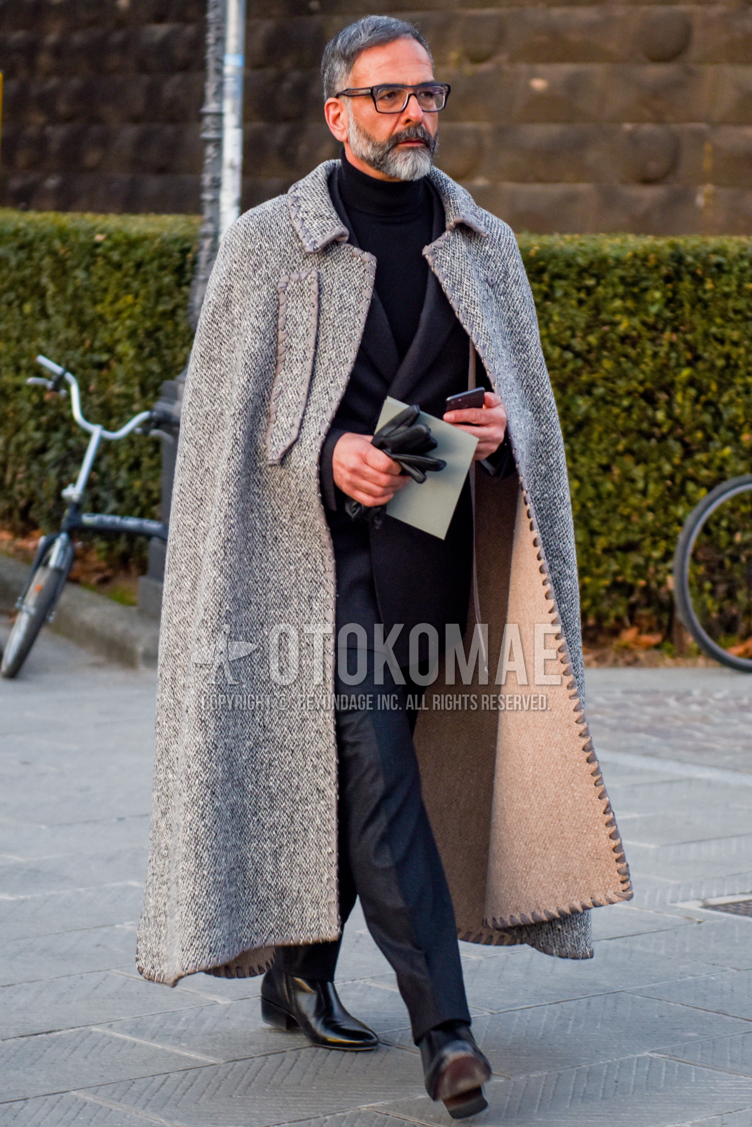 Men's autumn winter outfit with black plain glasses, gray outerwear stenkarrer coat, black plain turtleneck knit, black  boots, gray plain suit.