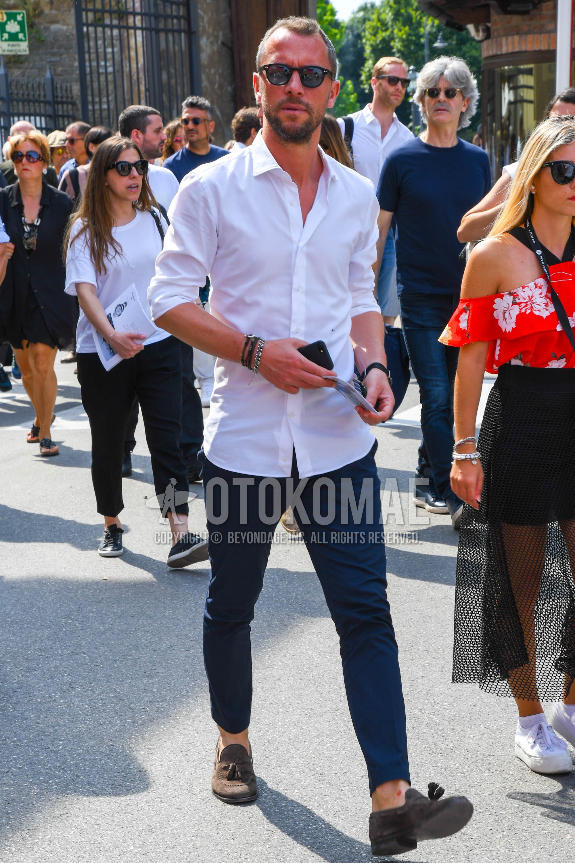 Men's spring summer outfit with plain sunglasses, white plain shirt, navy plain chinos, beige tassel loafers leather shoes, suede shoes leather shoes.