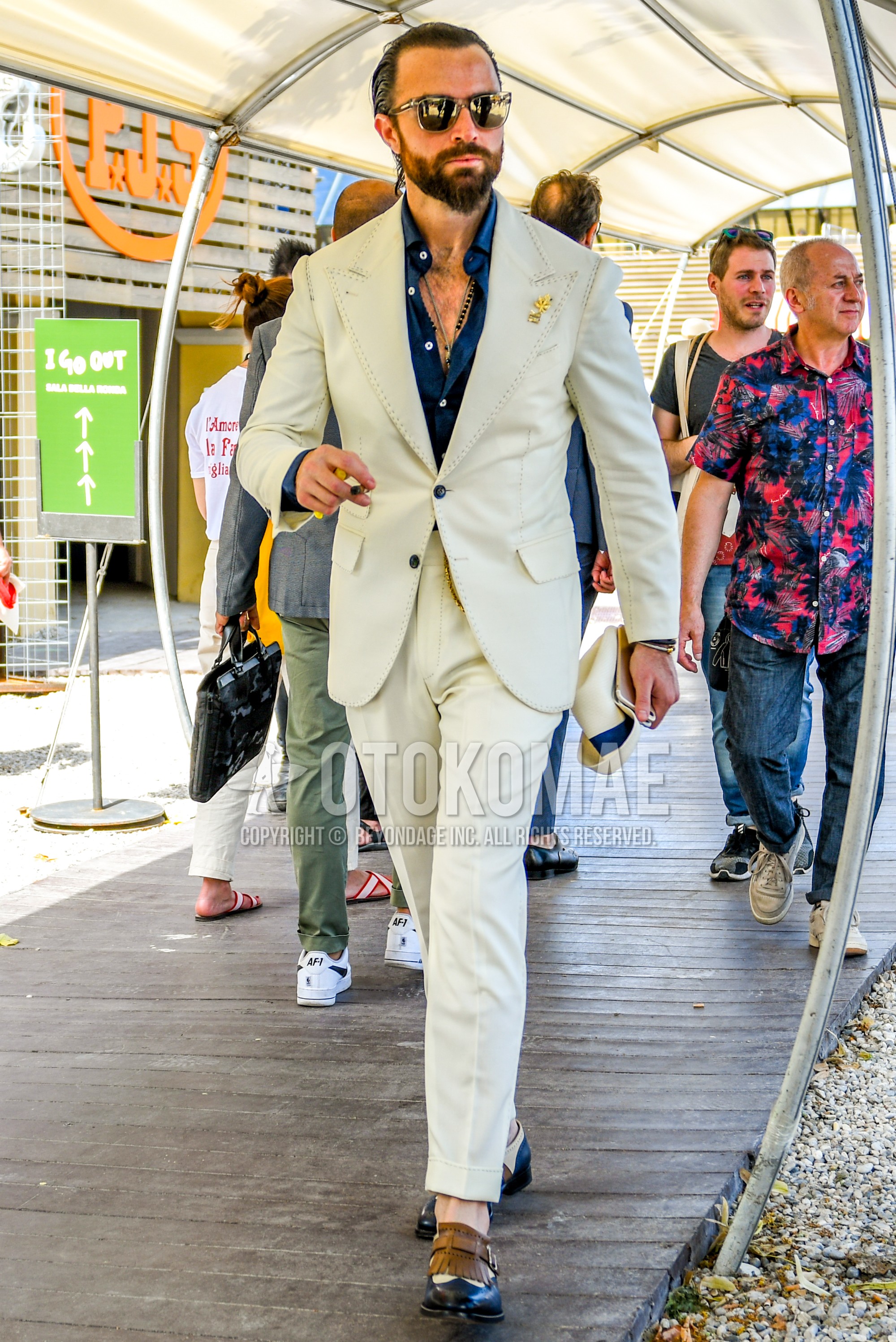 Men's spring summer autumn outfit with plain sunglasses, navy plain shirt, multi-color  leather shoes, white plain suit.